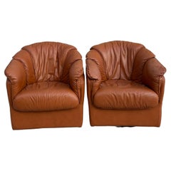Beautiful pair of leather Swivel chairs Post modern design Natuzzi Salotti