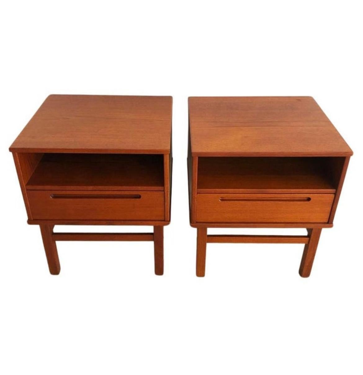 Beautiful pair of teak mid century nightstands made in Denmark. Designed by Nils Jonsson for HJN Mobler. Square body and legs. Single cubby and upper drawer with inset handle. Dovetail construction is beautiful. Good vintage condition clean inside
