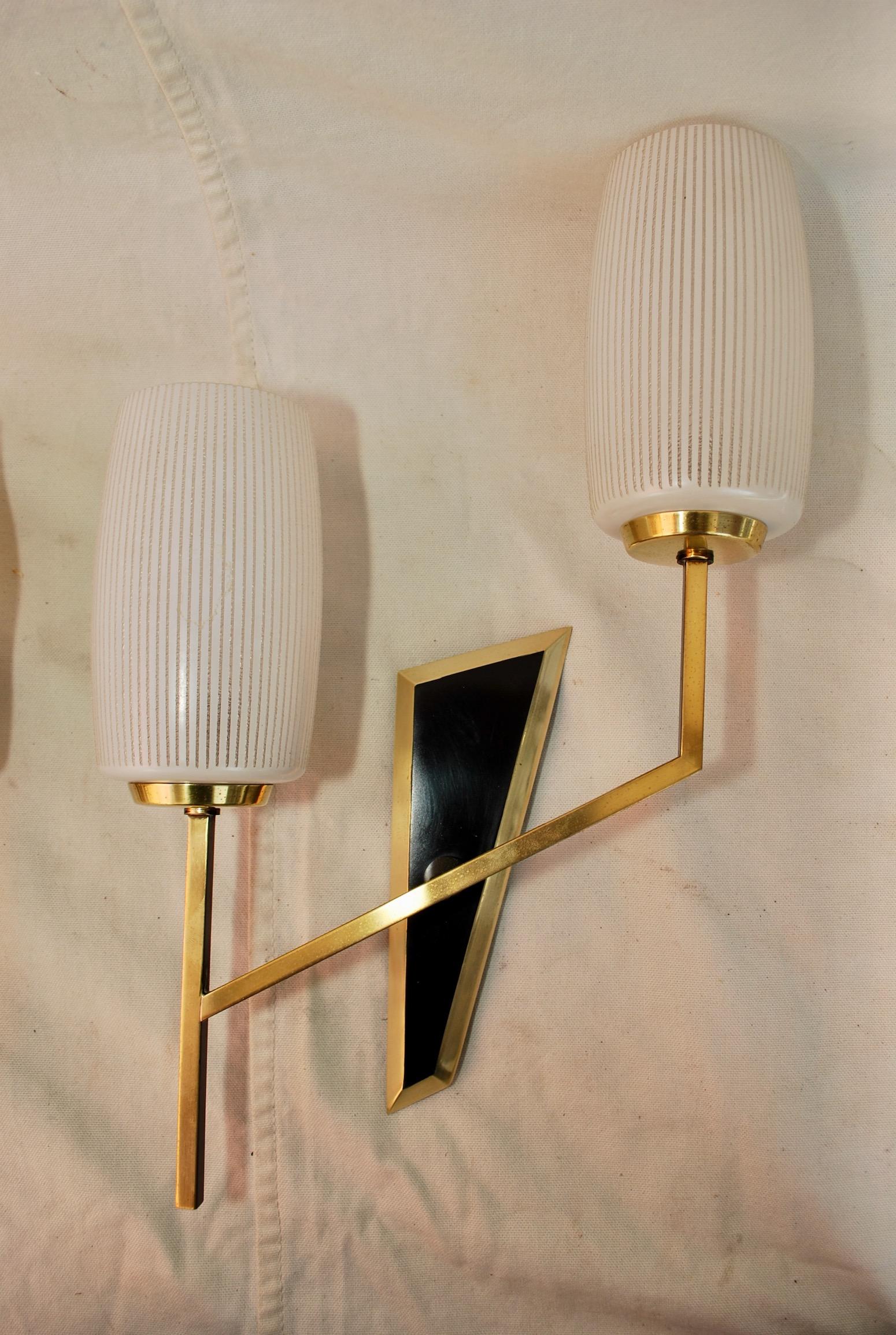 A sexy pair of midcentury French sconces, the picture speak for it self.

 