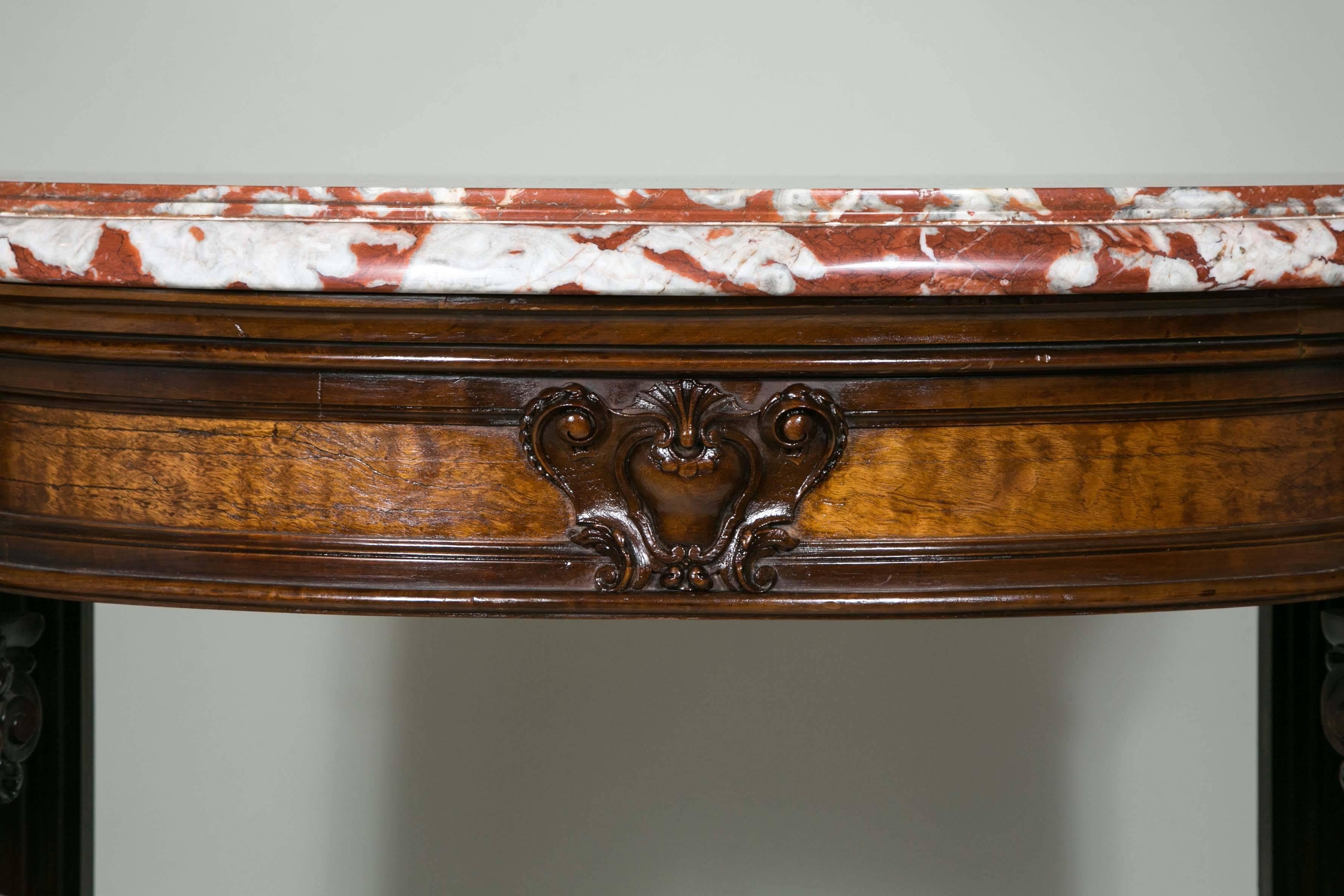 Beautiful pair of Napoleon III consoles covered with a thick red and white marble, the 19th century.
Measures: H 106cm, W 97cm, W 52cm.