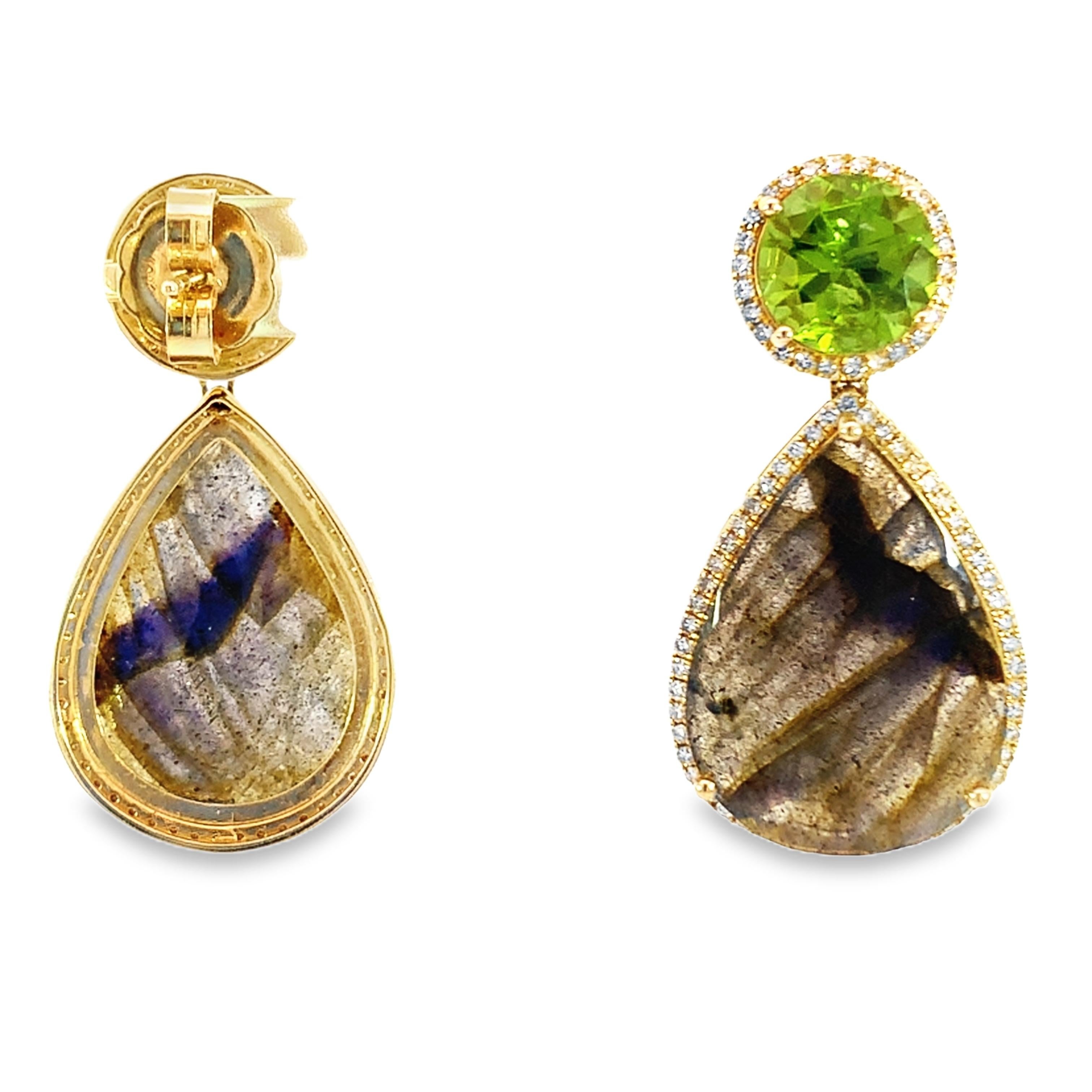 The dazzling combination of 24.92-carat labradorite with 8.08-carat peridot is featured in these gorgeous 14-karat yellow gold earrings. The 1.22 carats sparkling diamonds that highlight each gemstones give the earrings a more flawless appearance.