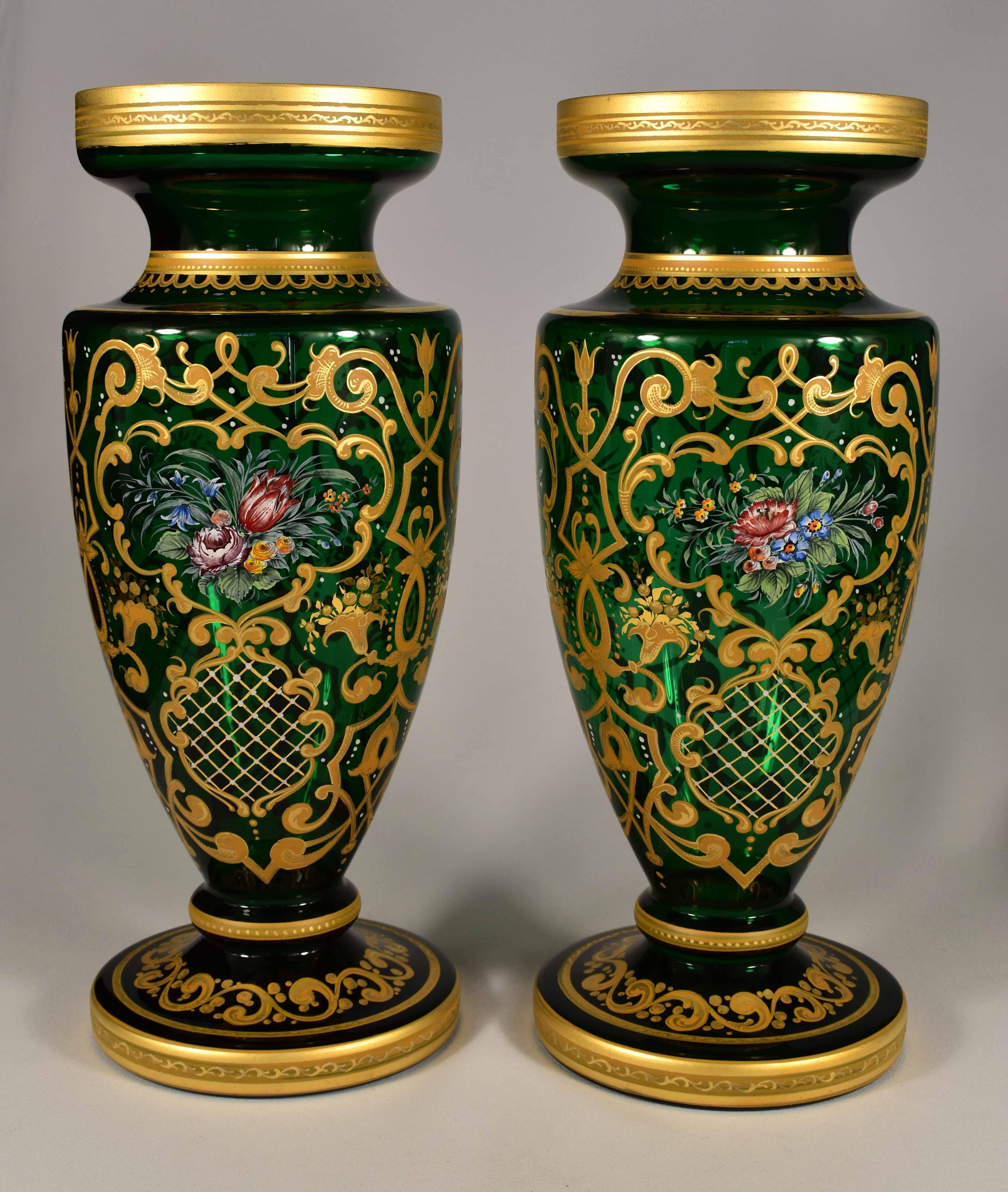 A beautiful pair of hand blown and painted vases, This is the art of Czech glassmakers of the 20th century in the style of the 19th century, Ornamental painting in ocher colors, supplemented with a floral motif, everything is gilded. A beautiful