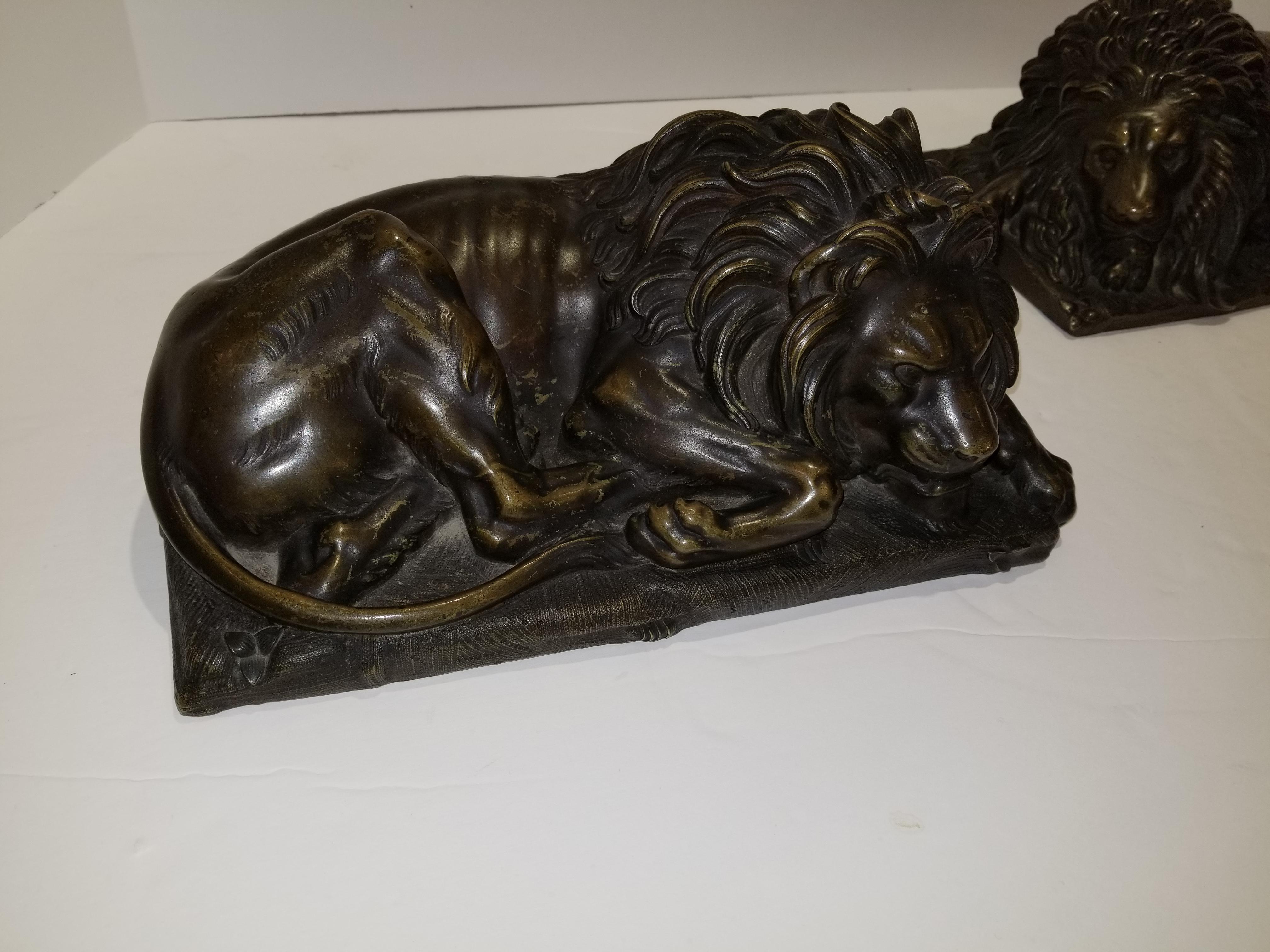 Louis XVI Beautiful Pair of Patinated Resting Lions, Signed by Bernoux and Huzel For Sale