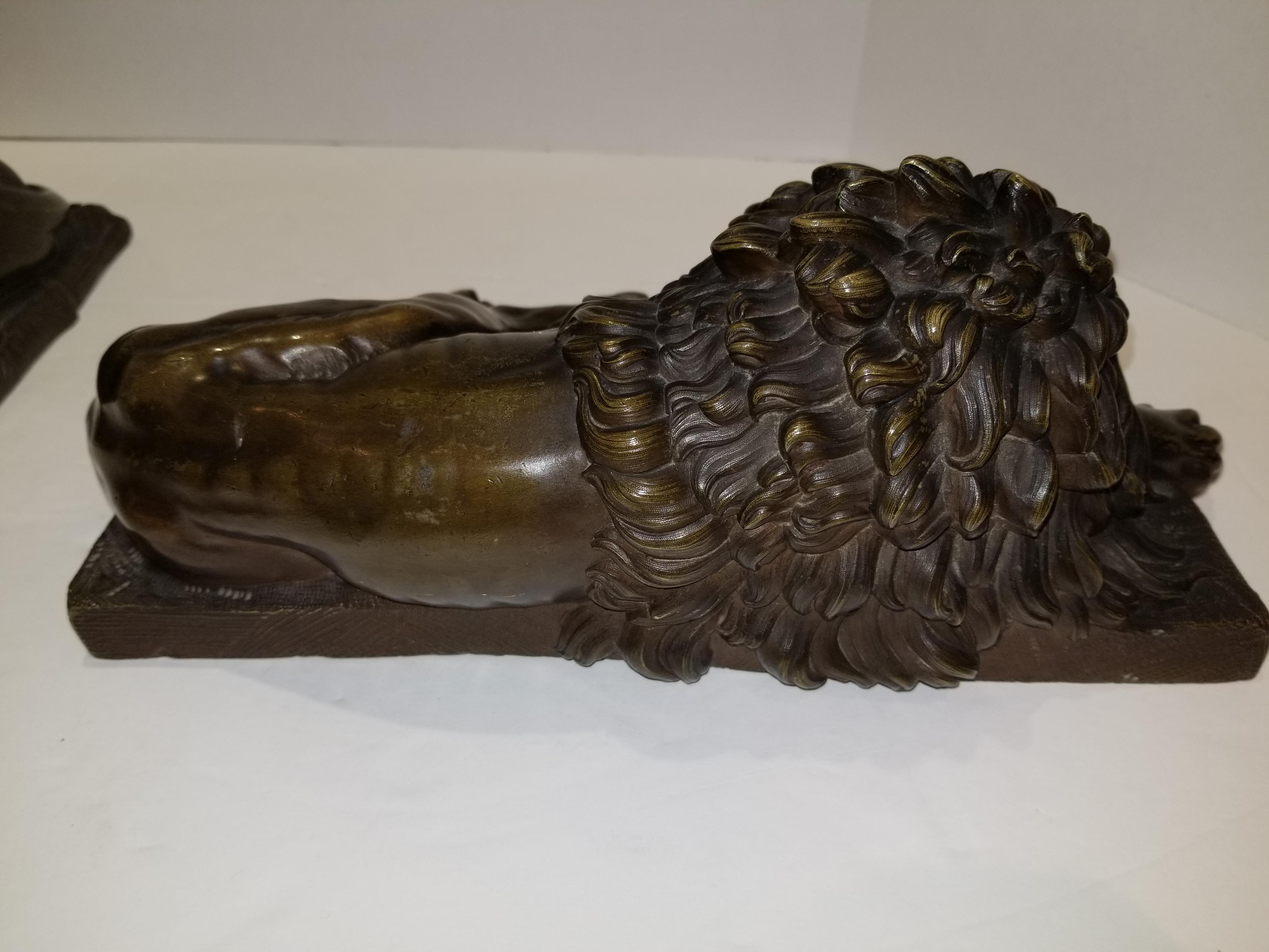 Beautiful Pair of Patinated Resting Lions, Signed by Bernoux and Huzel In Excellent Condition For Sale In New York, NY
