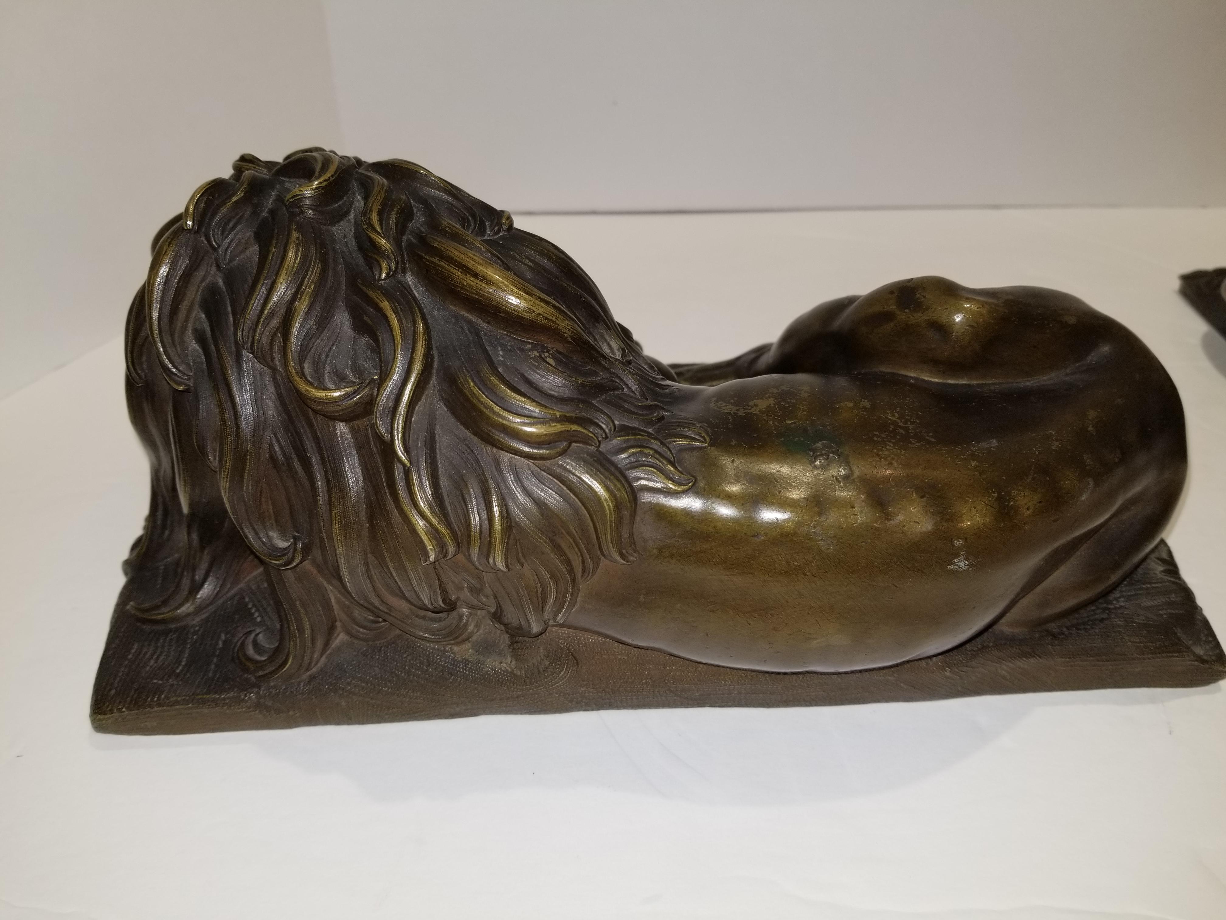 19th Century Beautiful Pair of Patinated Resting Lions, Signed by Bernoux and Huzel For Sale