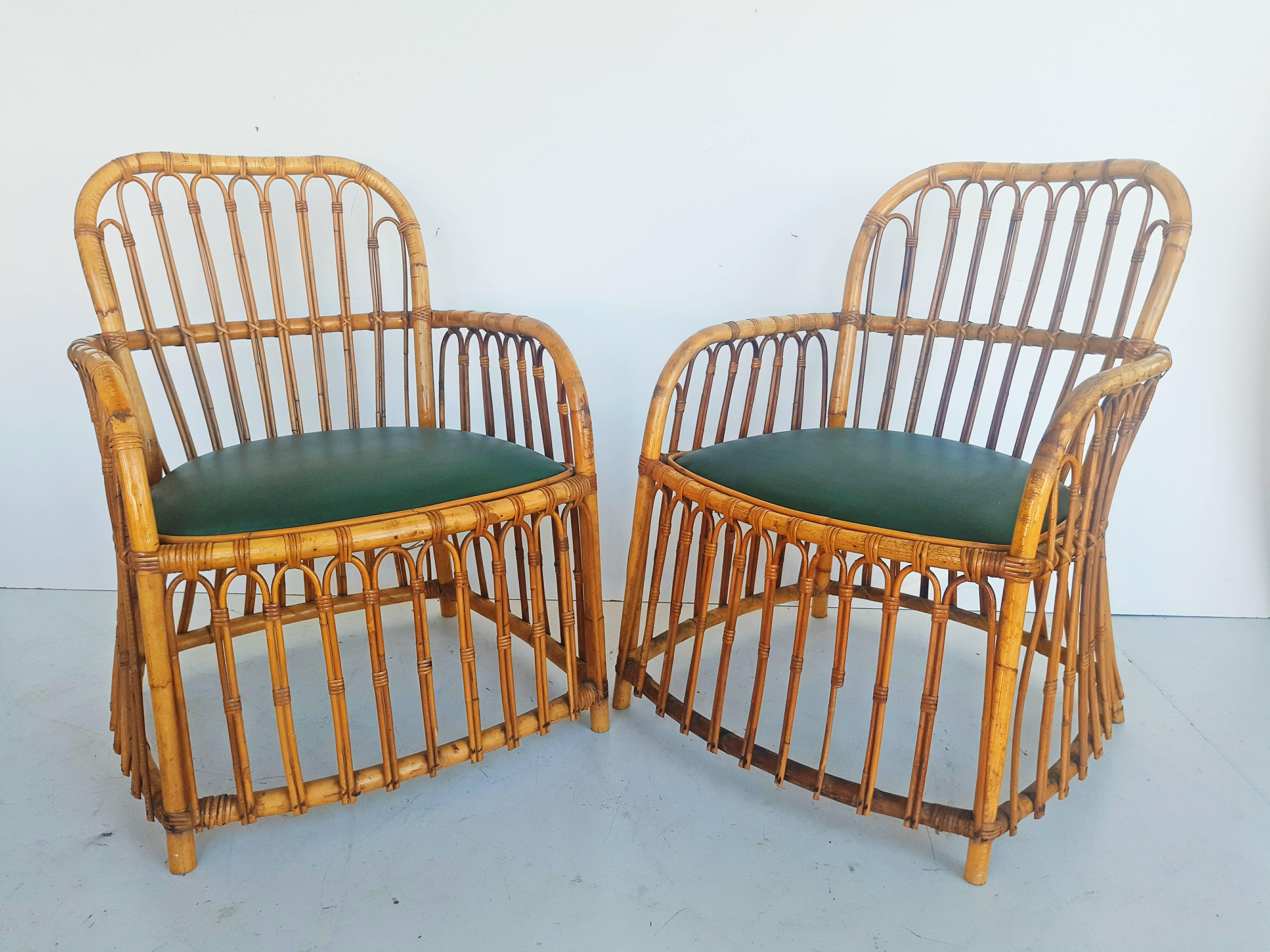 Beautiful and rare pair of rattan armchairs manufactured in Spain by 