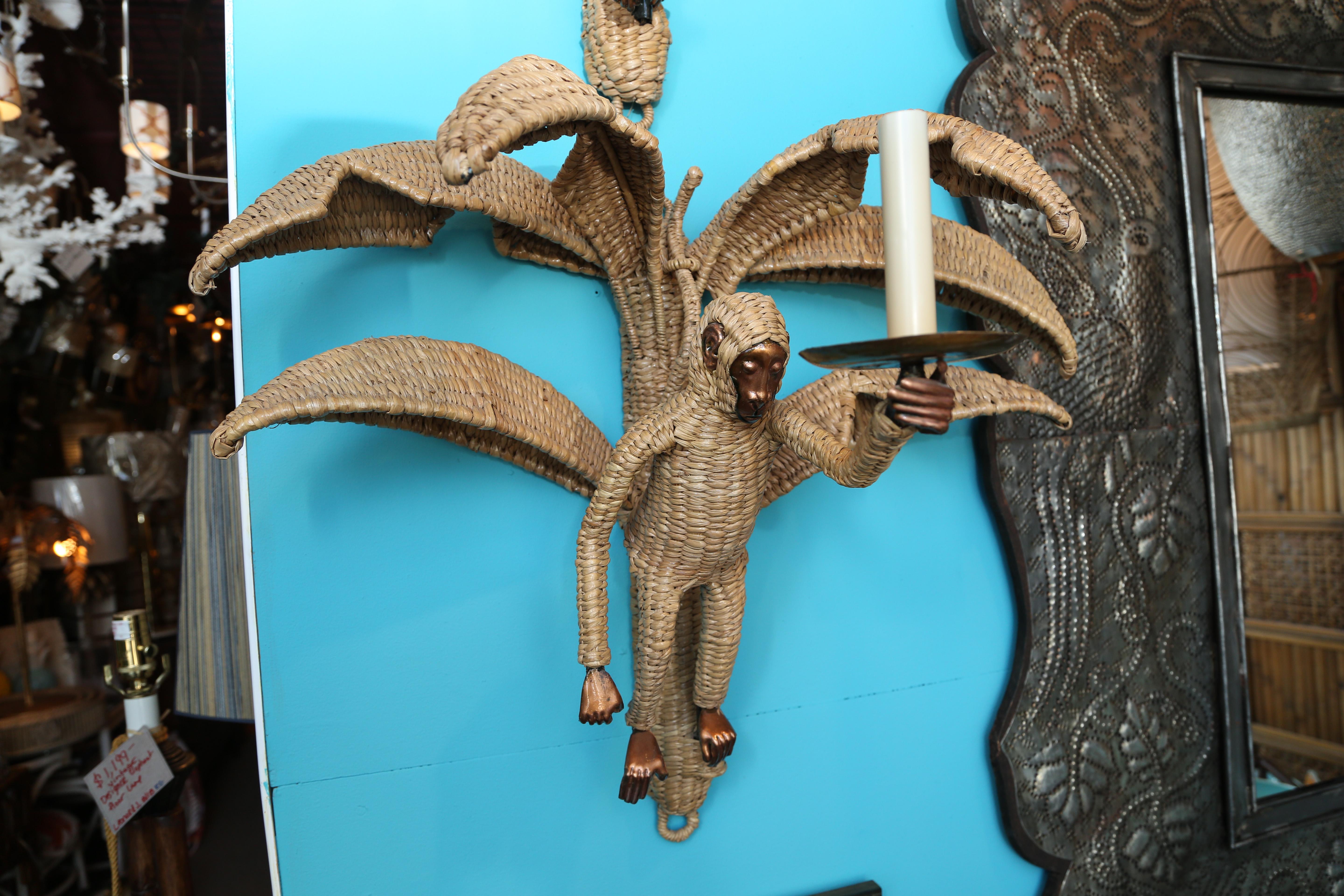Pair of Like New vintage Mario Lopez Torres Monkey sconces $2,899 like new condition pair of Mario Lopez Torres wicker monkey sconces with palm tree leaves, brass faces and feet, hands, and ears. These sconces are constructed of a metal frame