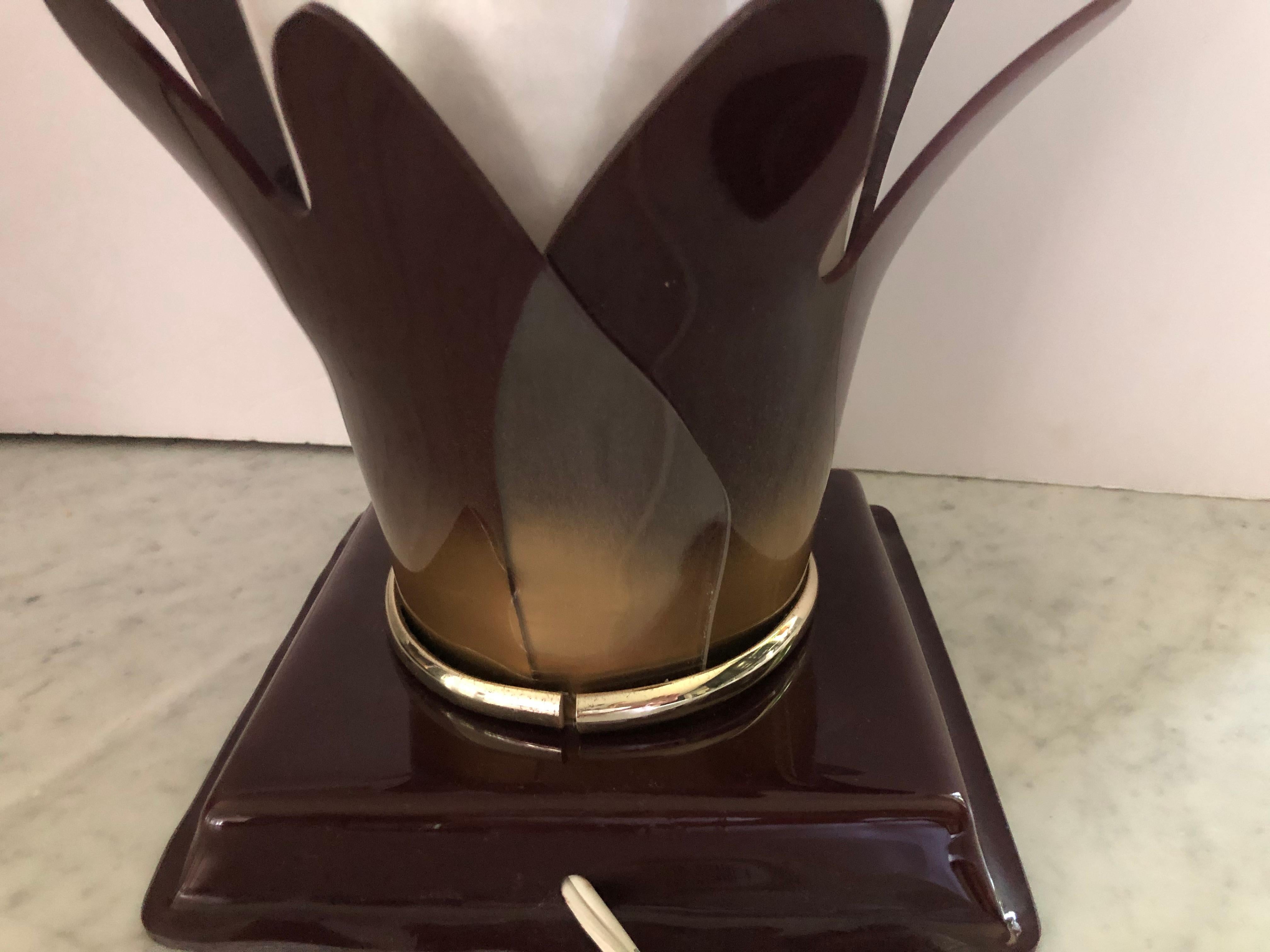 Super chic pair of Lucite vintage torchieres by Armani in the shape of stylized calla lilies. The lily itself is a pearlescent plastic material. Lamps take 15 W bulbs. Signed “Armani”.