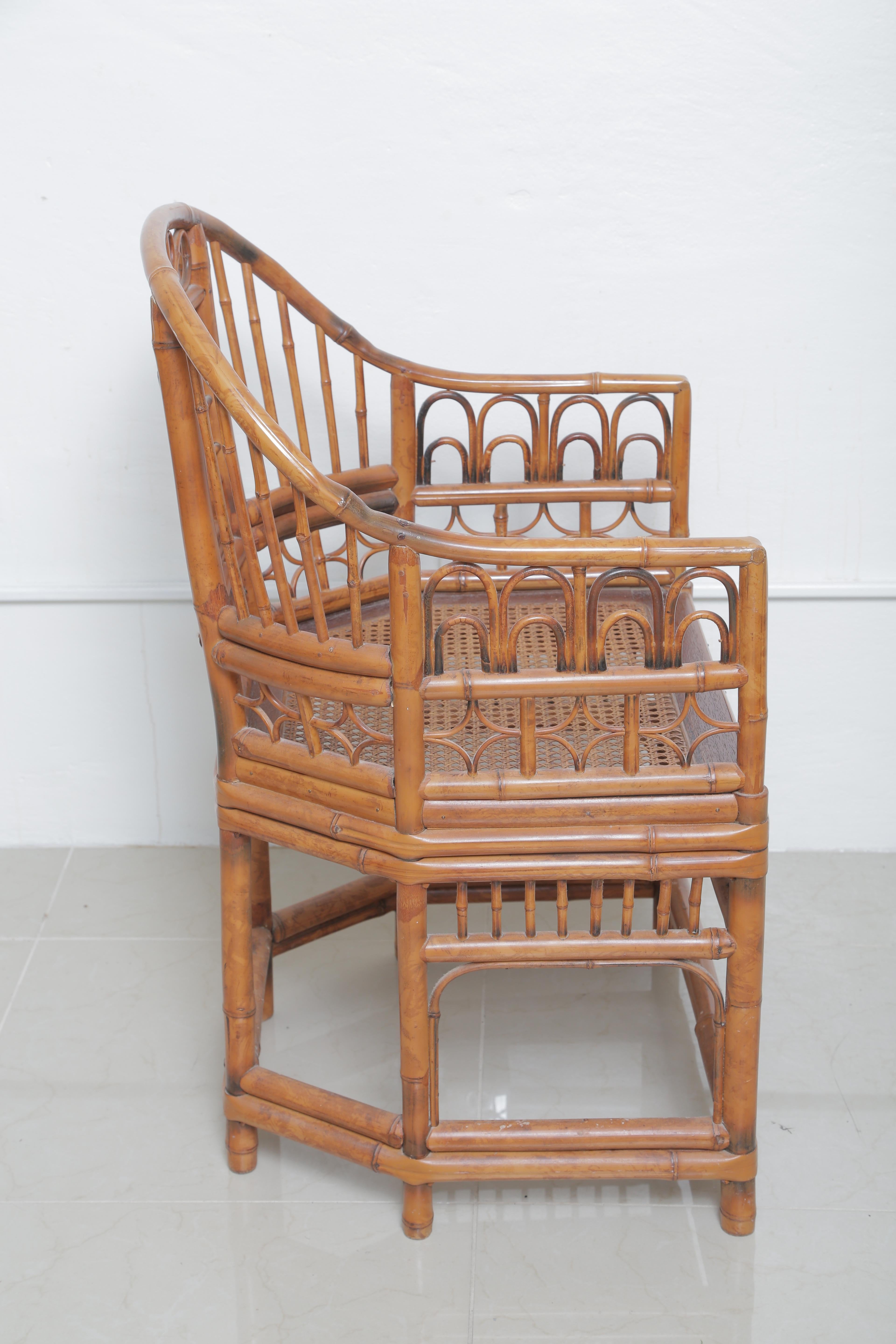 Beautiful pair of vintage English Regency bamboo style armchairs with cane seat.