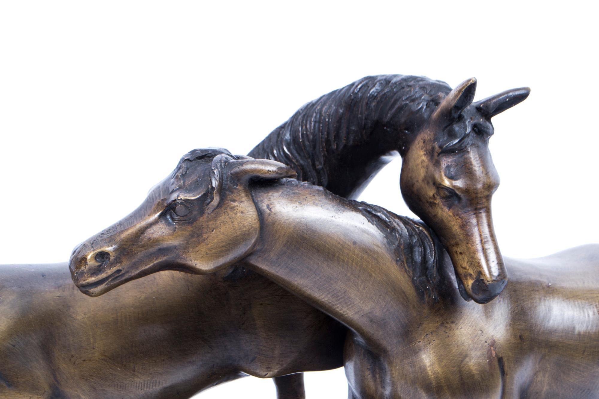 A stunning and extremely lifelike bronze sculpture of two thoroughbred horses, from the last quarter of the 20th century.

The piece is set on an attractive marble base.

Bearing the replica signature of 'J Mene.'

This high quality bronze is