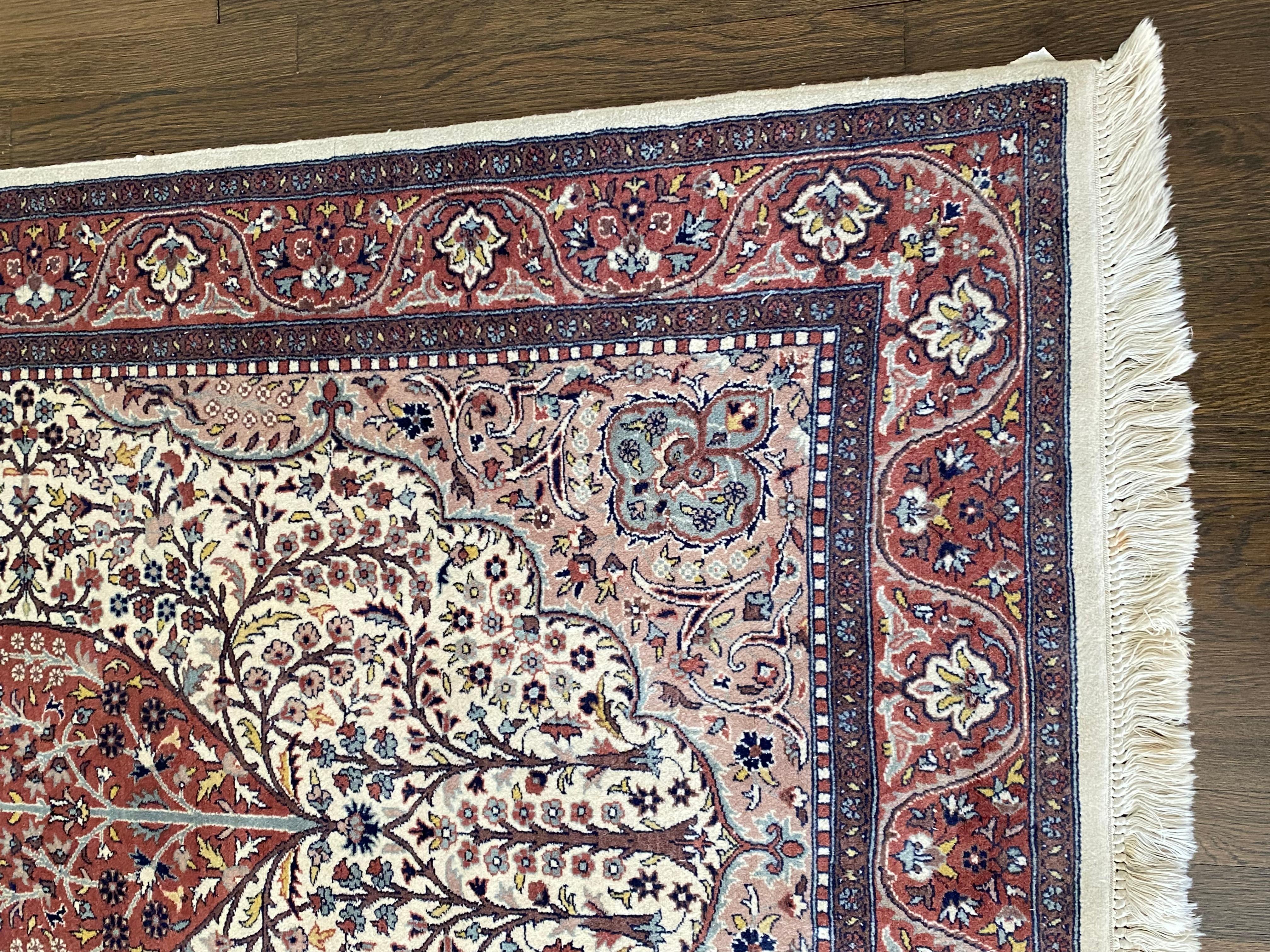 Classic Pakistani 100% wool geometric pattern rug with beautiful colors including plum, pale blue, lavender and cream.