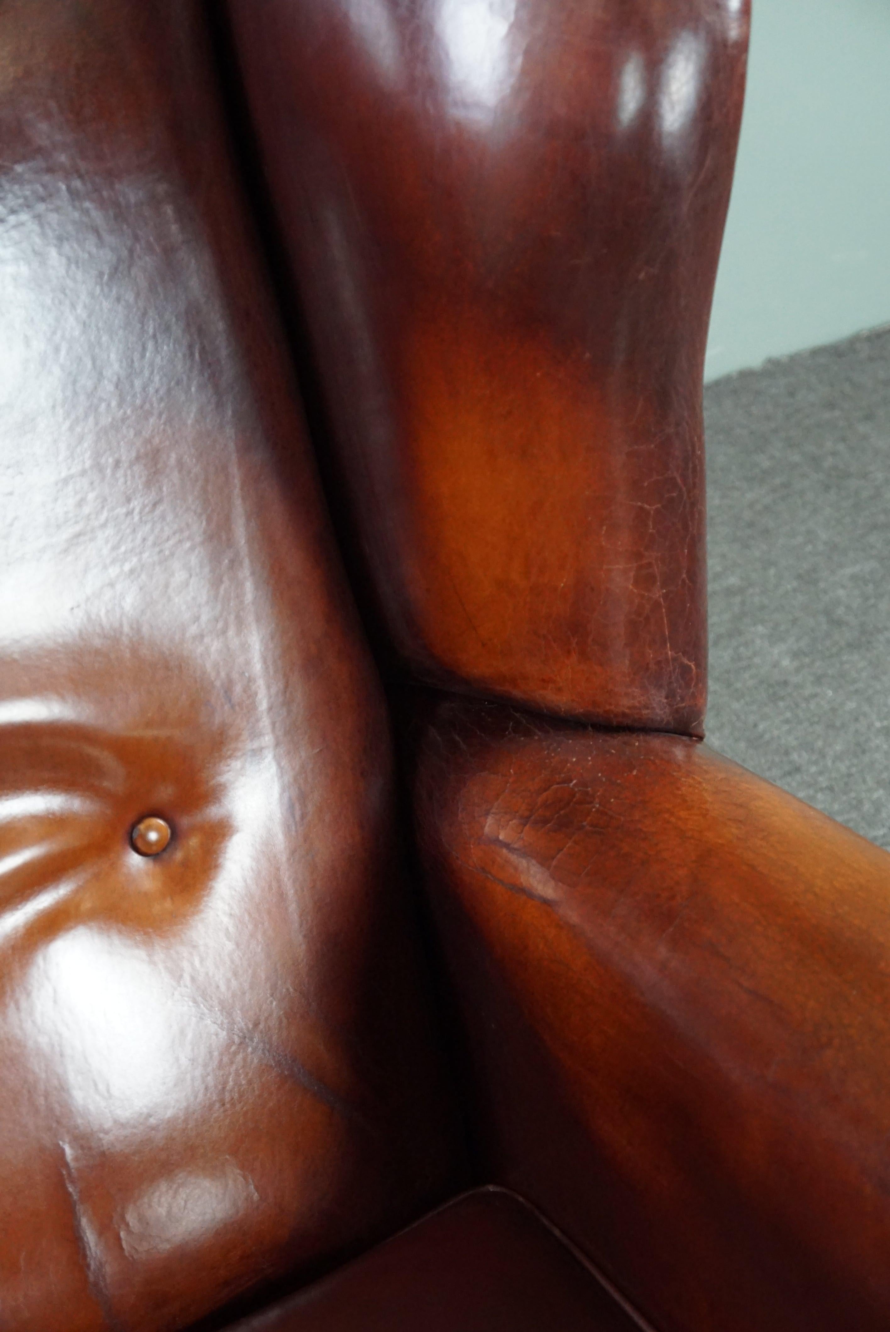 Beautiful patinated sheepskin leather armchair For Sale 3