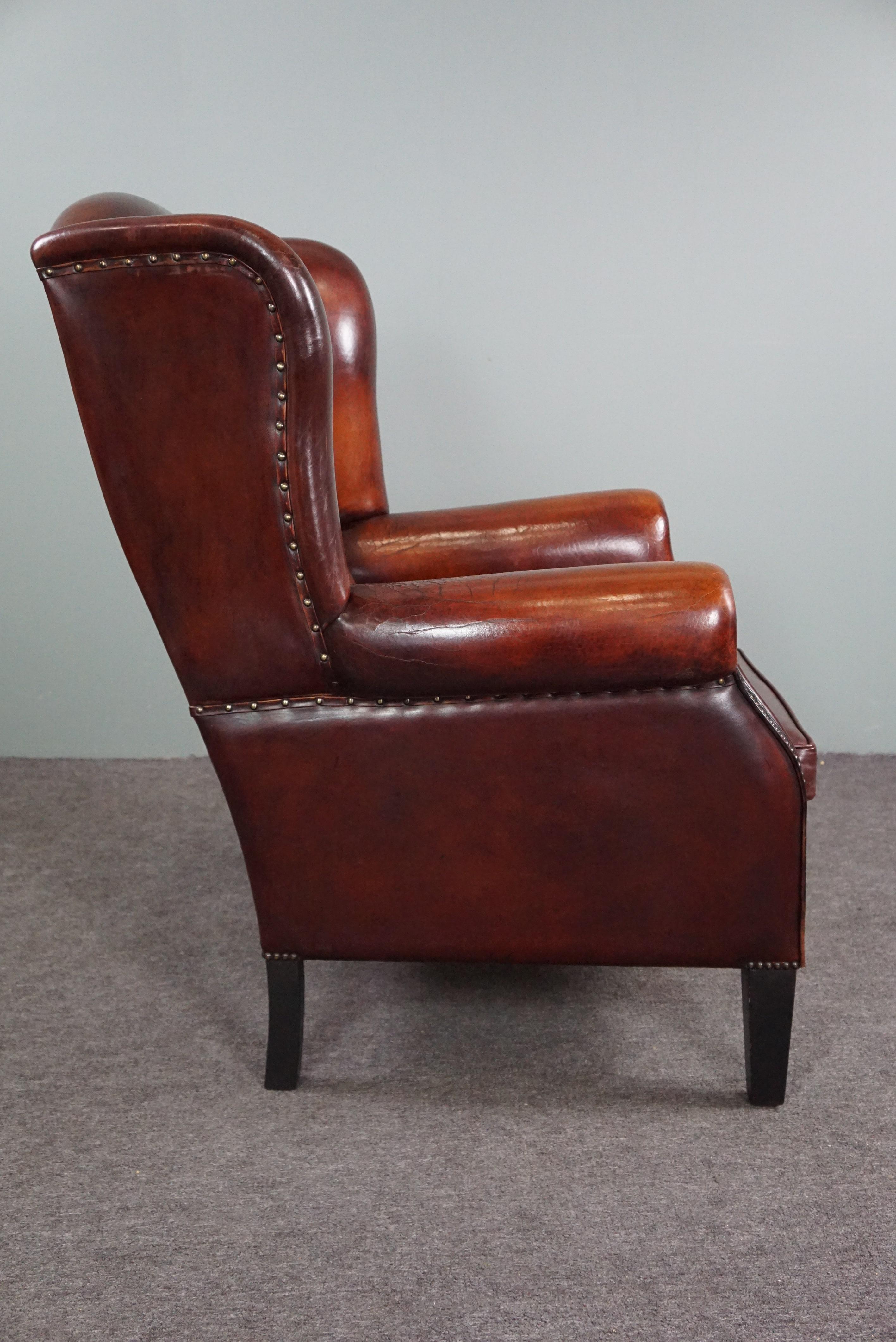 Dutch Beautiful patinated sheepskin leather armchair For Sale