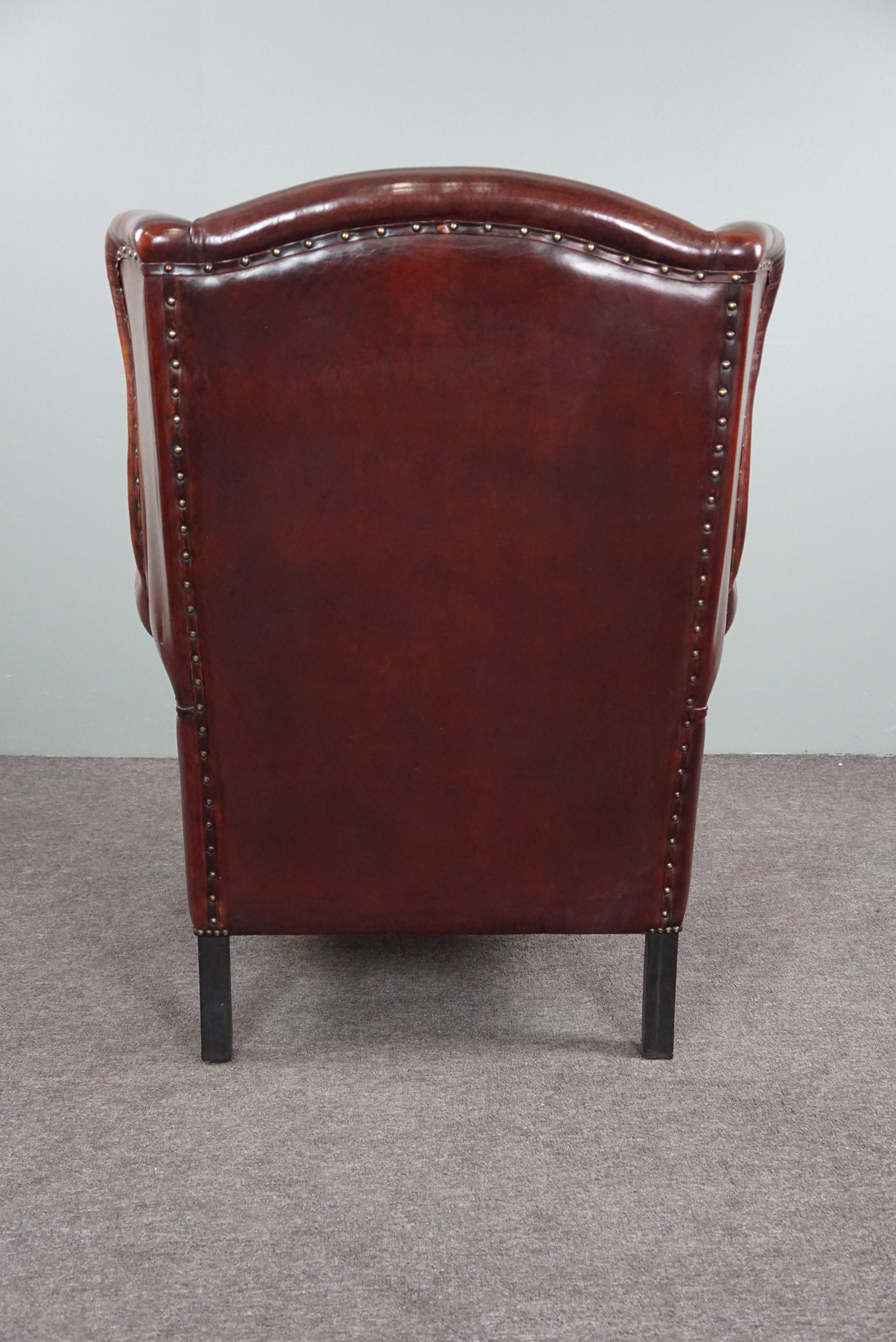 Hand-Crafted Beautiful patinated sheepskin leather armchair For Sale