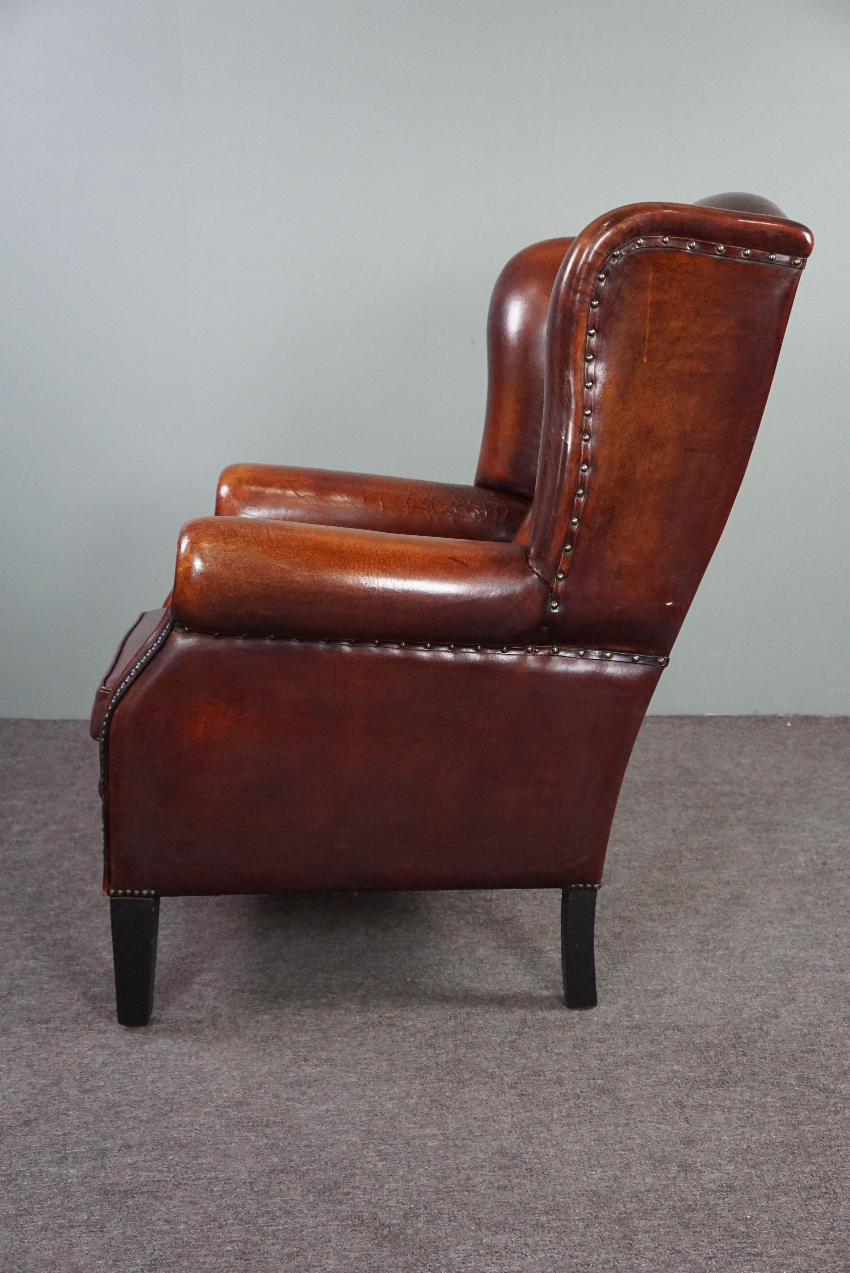 Beautiful patinated sheepskin leather armchair In Good Condition For Sale In Harderwijk, NL