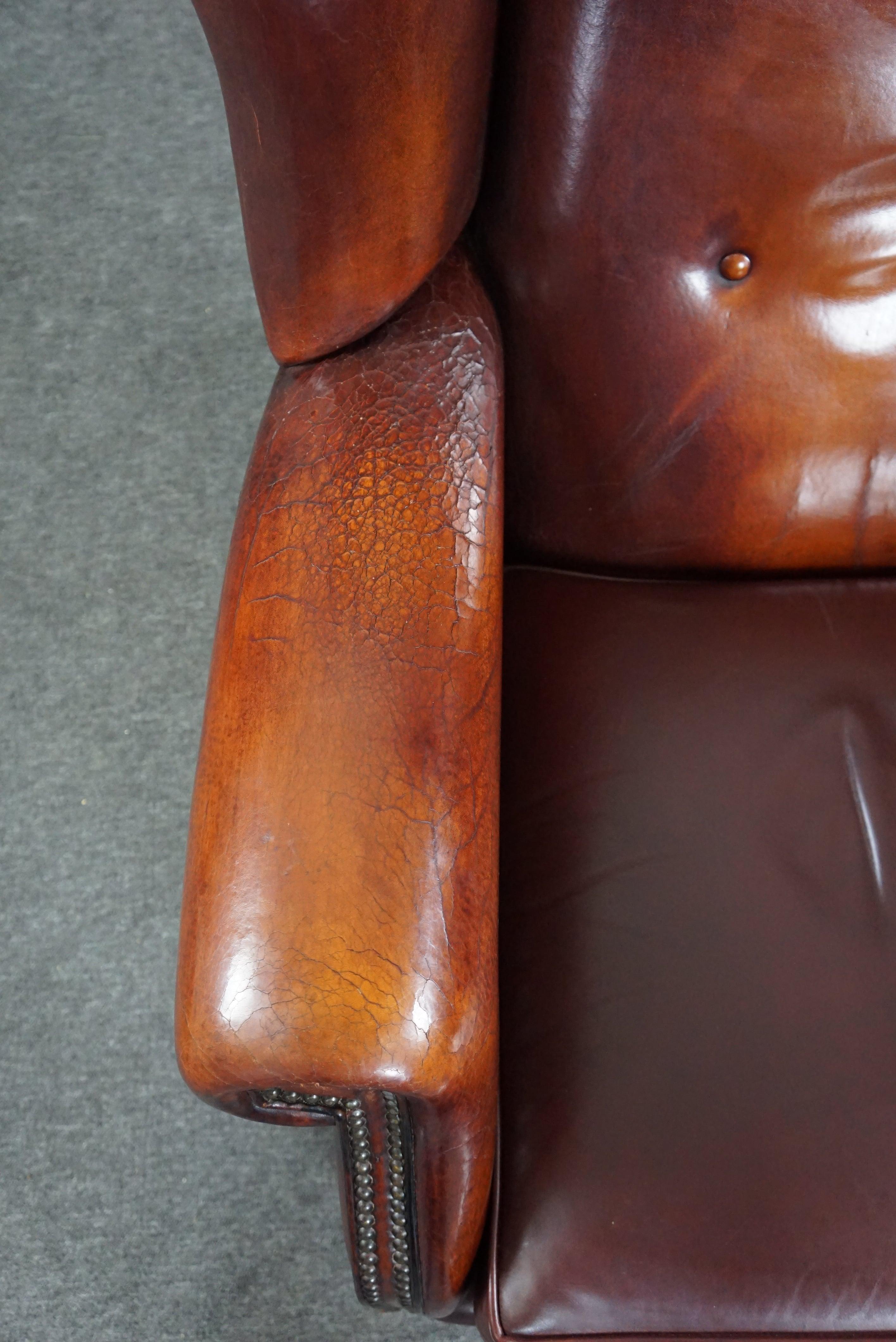 Leather Beautiful patinated sheepskin leather armchair For Sale