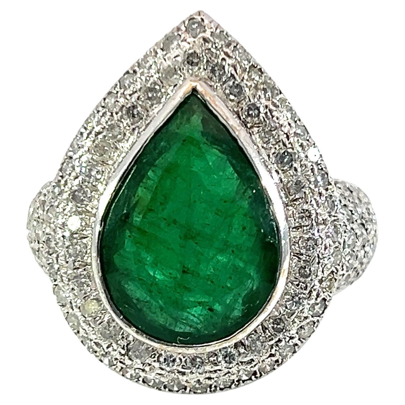 Beautiful pear shape natural emerald and diamond ring