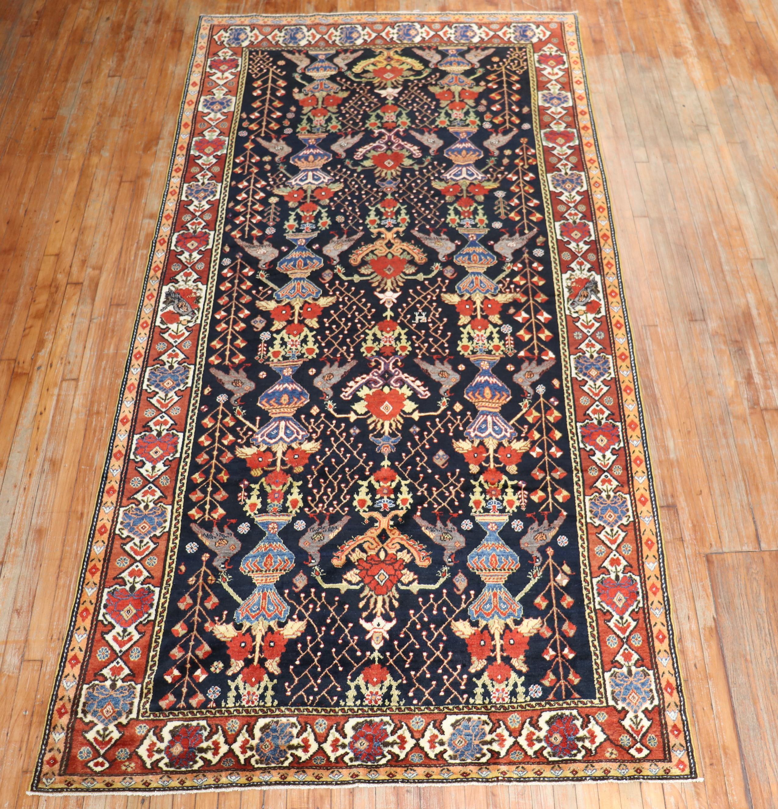 an early 20th century Persian Bakhtiari Gallery size rug

Measures: 5'8'' x 11'4''.