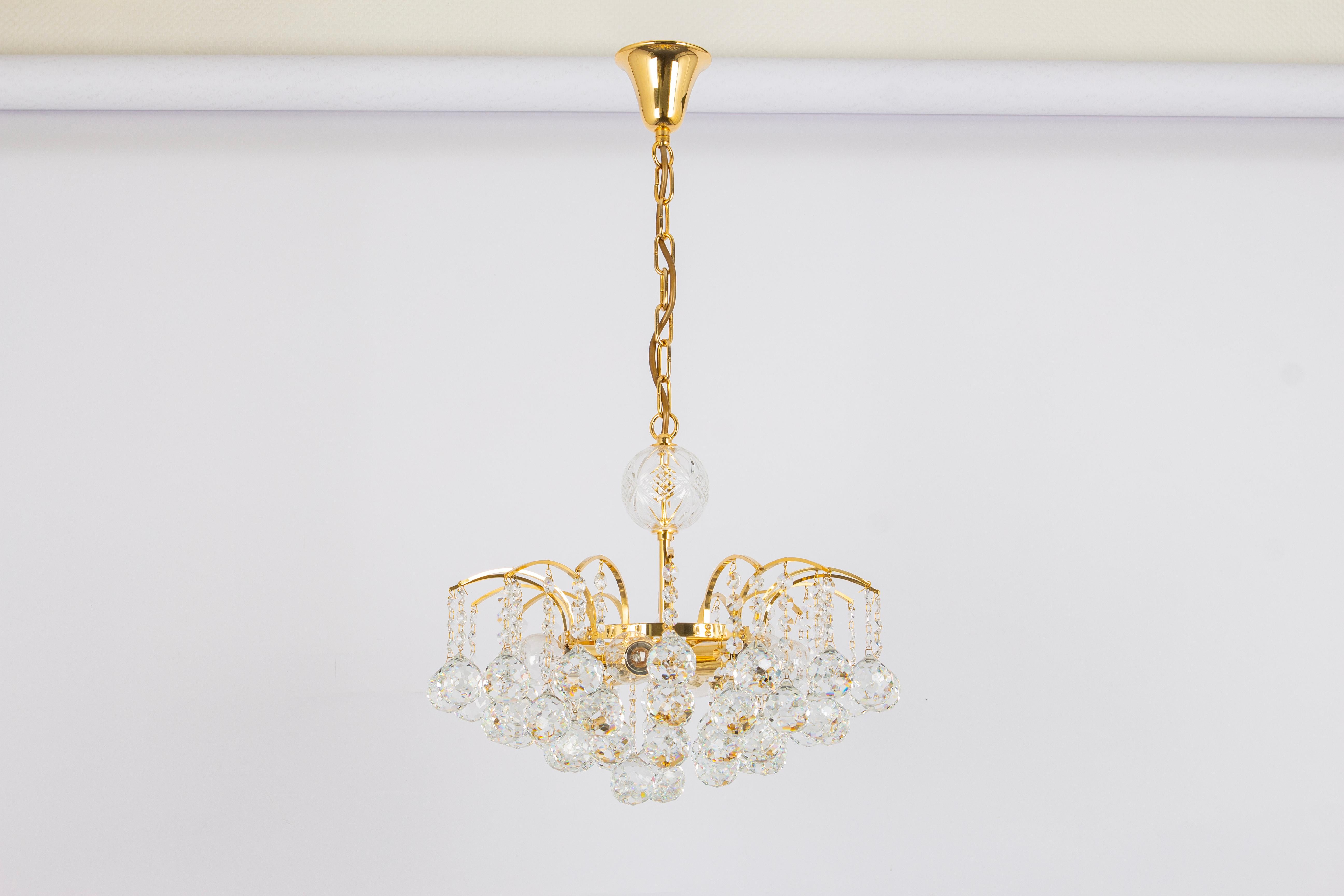 Elegant Petite Chandelier with wonderful crystal balls on a brass base suspended from tiny hooks.
From: Christoph Palme, Germany, circa 1970s. 

High quality and in very good condition. Cleaned, well-wired and ready to use. 

The fixture requires 6