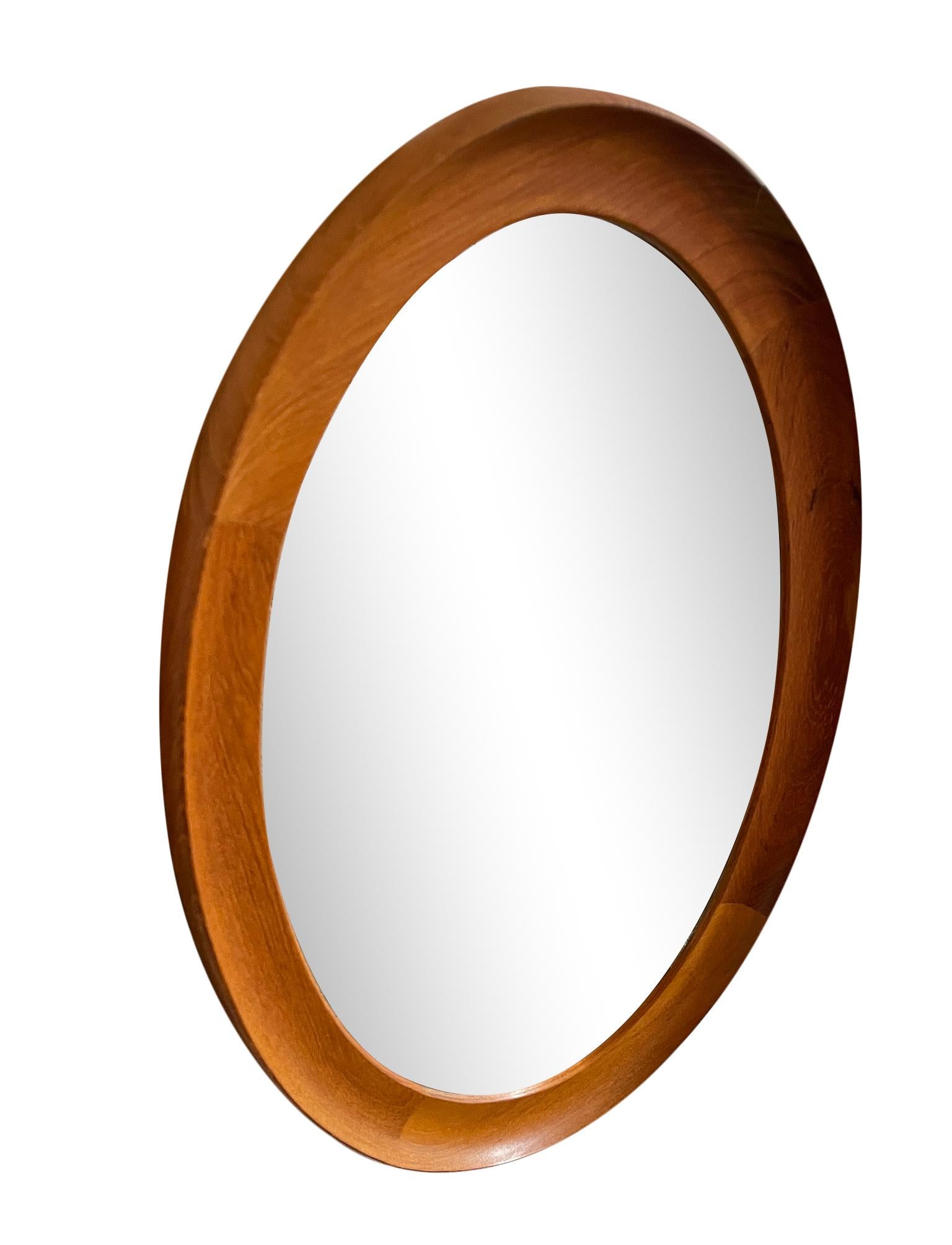 Beautiful petite oval teak Danish wall mirror made in Denmark. Labeled on Back - Stamped number 306. has small brass hanger. Located in Brooklyn NYC. Clean Mirror Circa 1960

Dimensions: 25