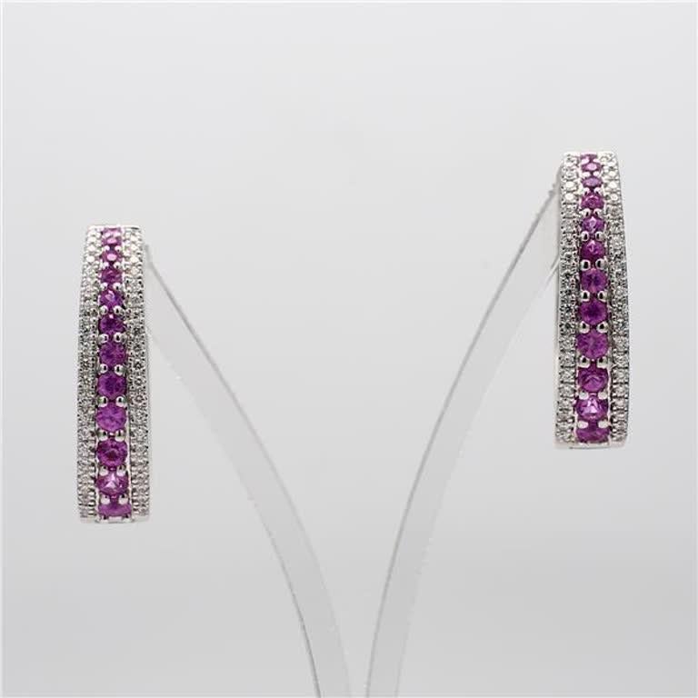 RareGemWorld's classic sapphire earrings. Mounted in a beautiful 14K White Gold setting with natural round cut pink sapphires. These earrings include both natural round pink sapphires and natural round white diamond melee in a beautiful interlocking