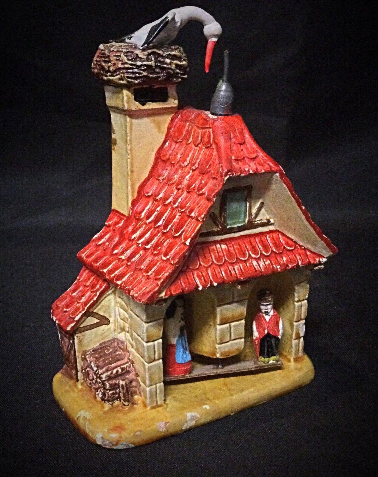 Add a charming and unique piece to your collection with this beautiful plaster house, inscribed with 