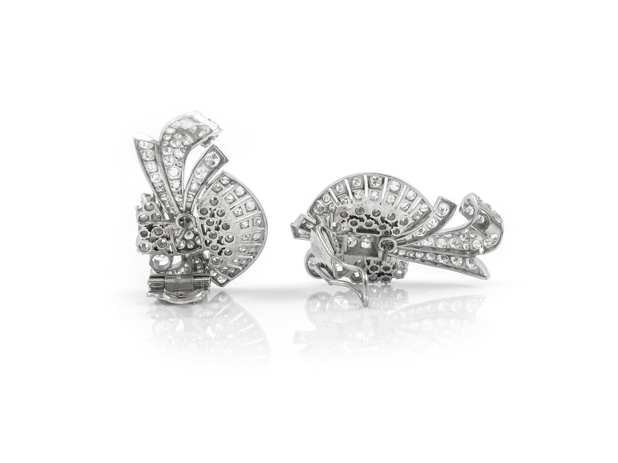 The earrings are finely crafted in platinum and weighing approximately total of 13.00 carat.
