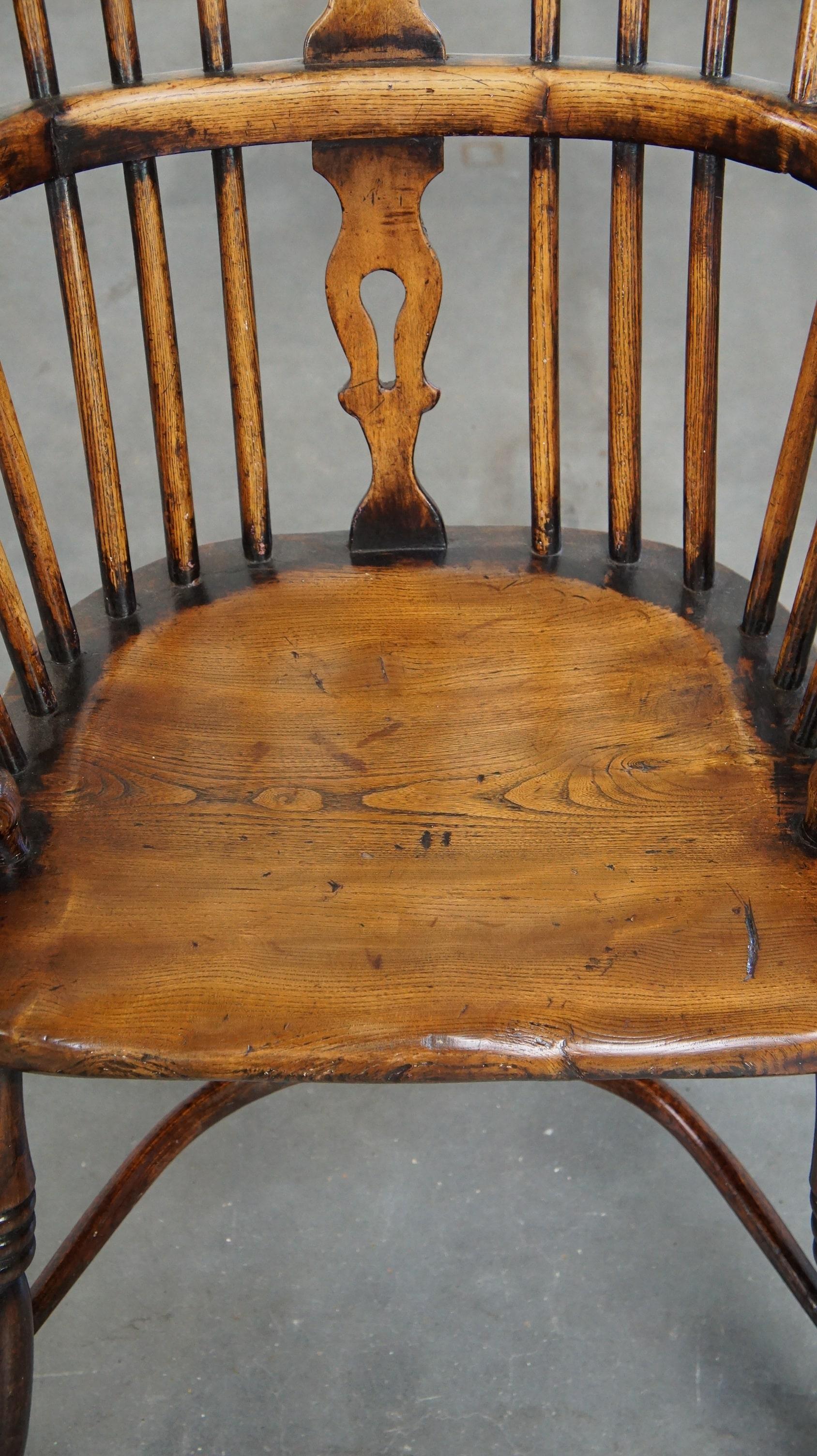 Wood Beautiful, practical antique English highback Windsor chair with a lovely patina For Sale
