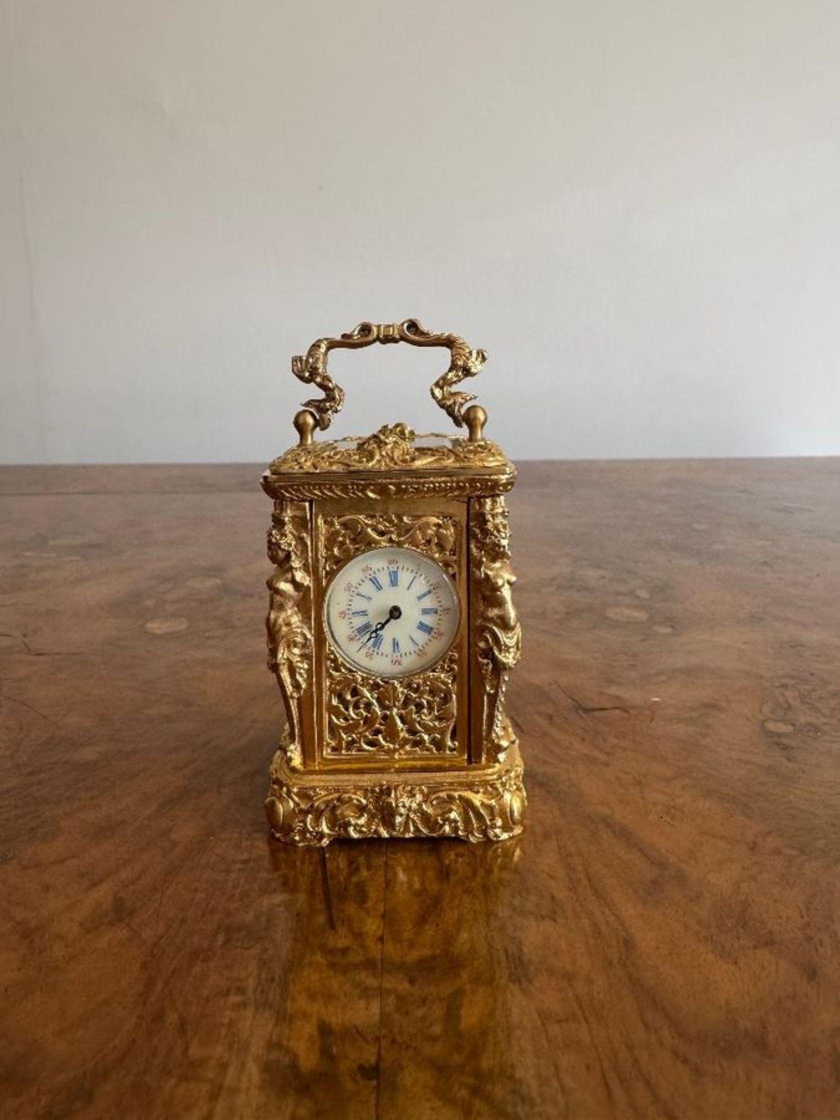 Beautiful quality antique Victorian ornate brass miniature carriage clock, having a beautiful quality antique Victorian ornate brass miniature carriage clock with intricate floral and scrollwork patterns and figural columns to the sides of the case
