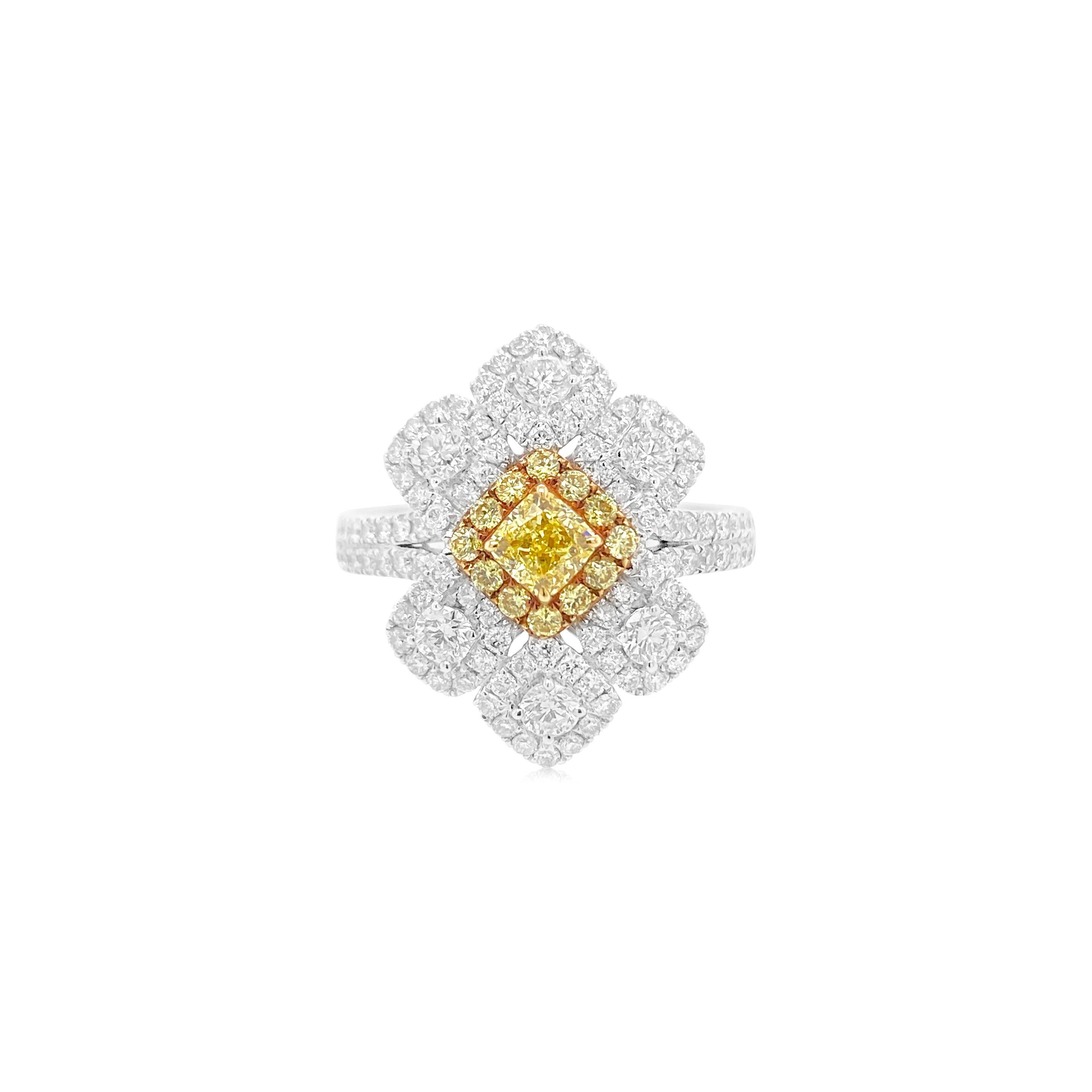 Dieser strahlende Cocktailring ist von den blühenden Blumen des Frühlings inspiriert. Fühlen Sie sich verjüngt und inspiriert mit diesem Ring mit einem zertifizierten intensiv gelben Diamanten in der Mitte, verziert mit weißen