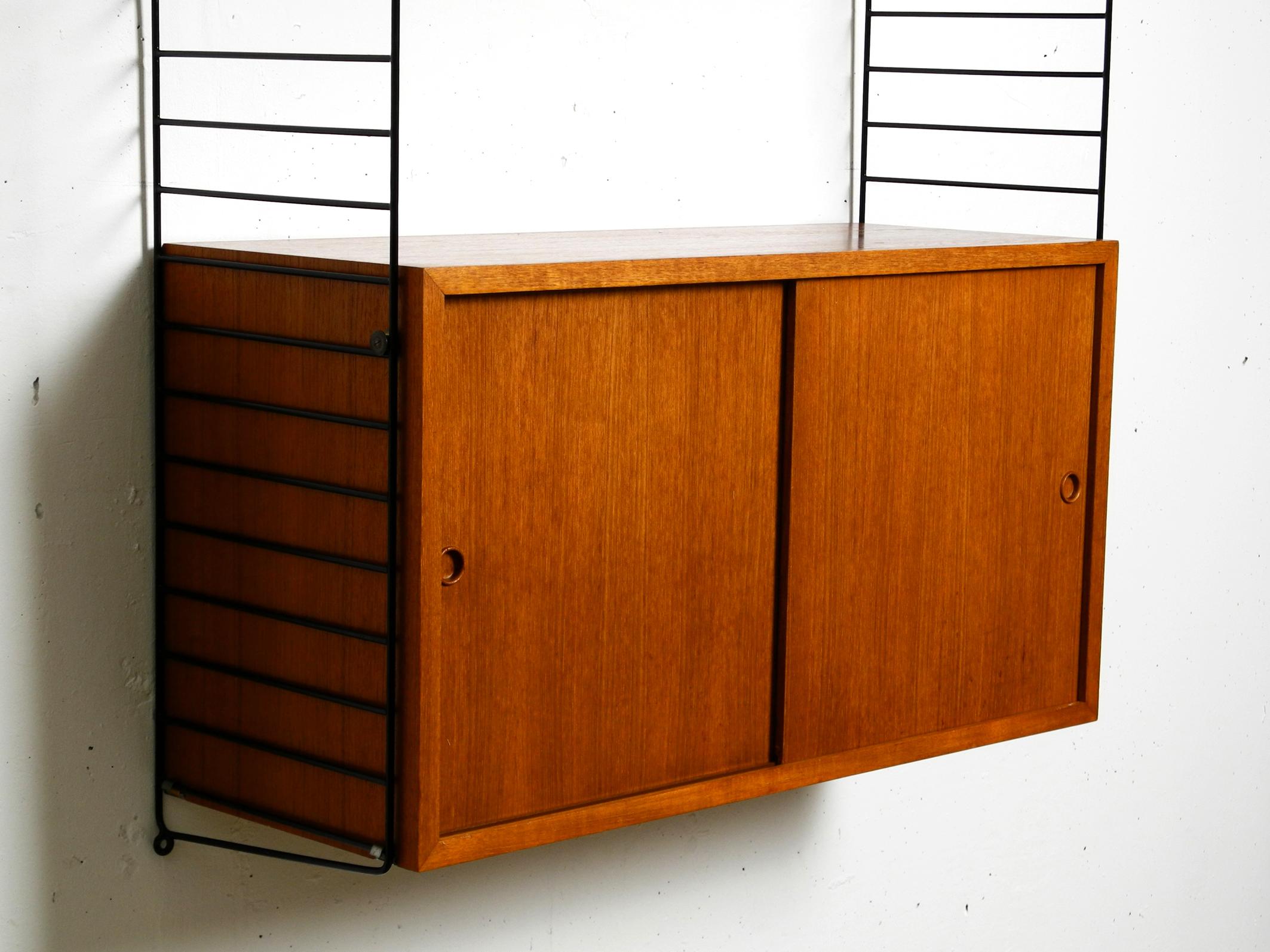 Original 1960s Nisse Strinning teak string shelf with 2 shelves and one cupboard 1