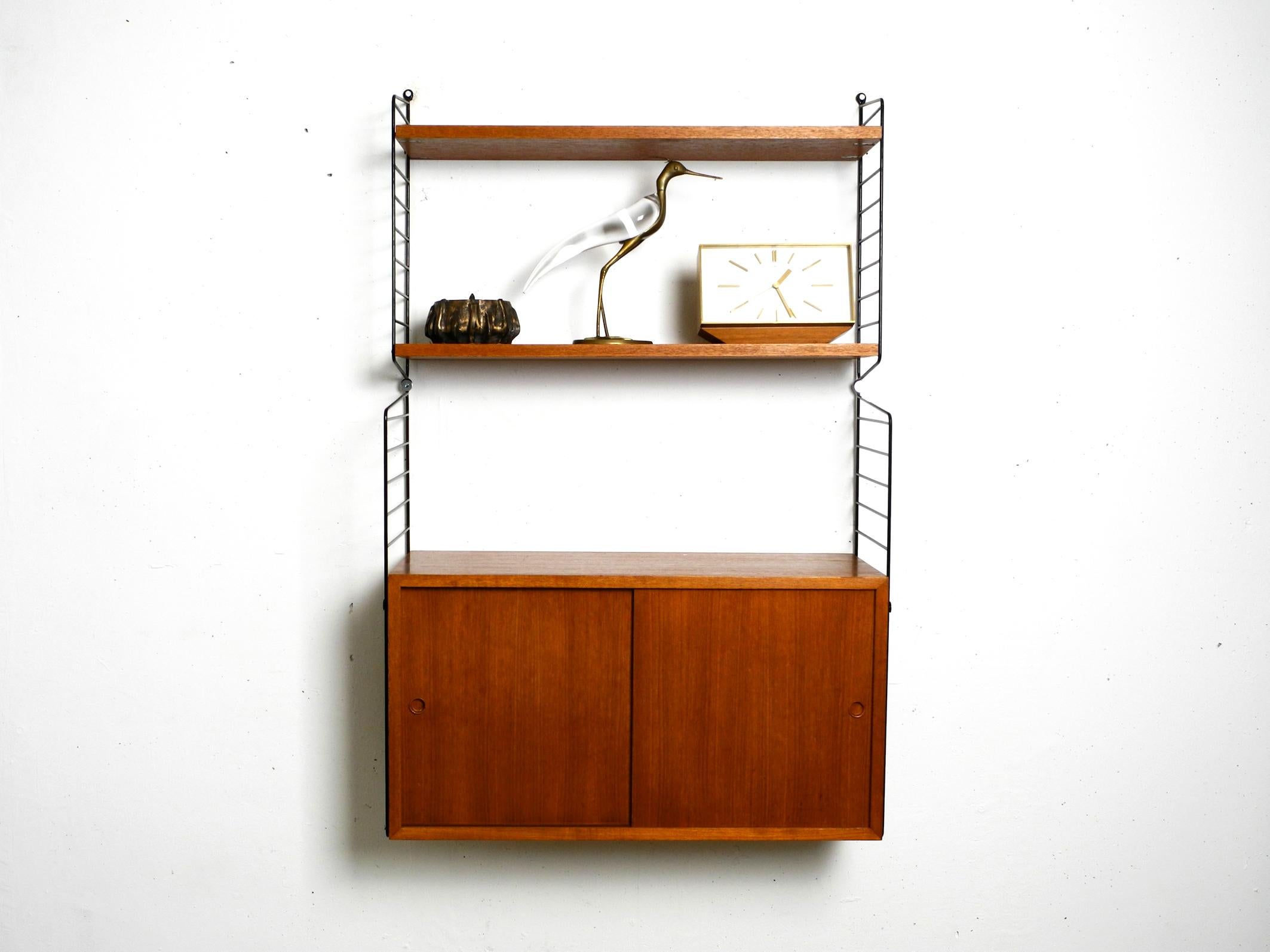 Original 1960s Nisse Strinning teak string shelf with 2 shelves and one cupboard 2
