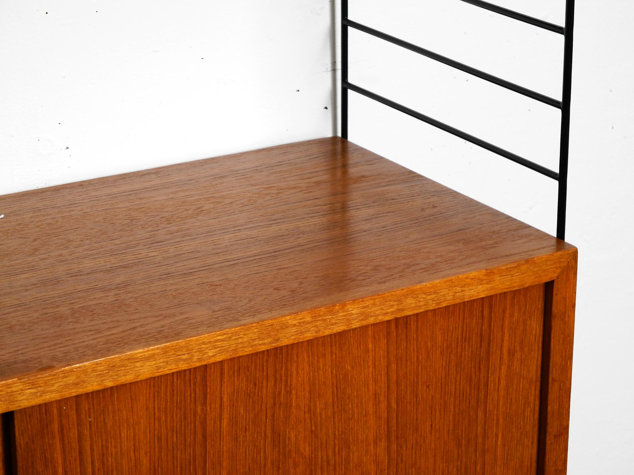 Mid-20th Century Original 1960s Nisse Strinning teak string shelf with 2 shelves and one cupboard