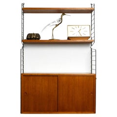 Original 1960s Nisse Strinning teak string shelf with 2 shelves and one cupboard