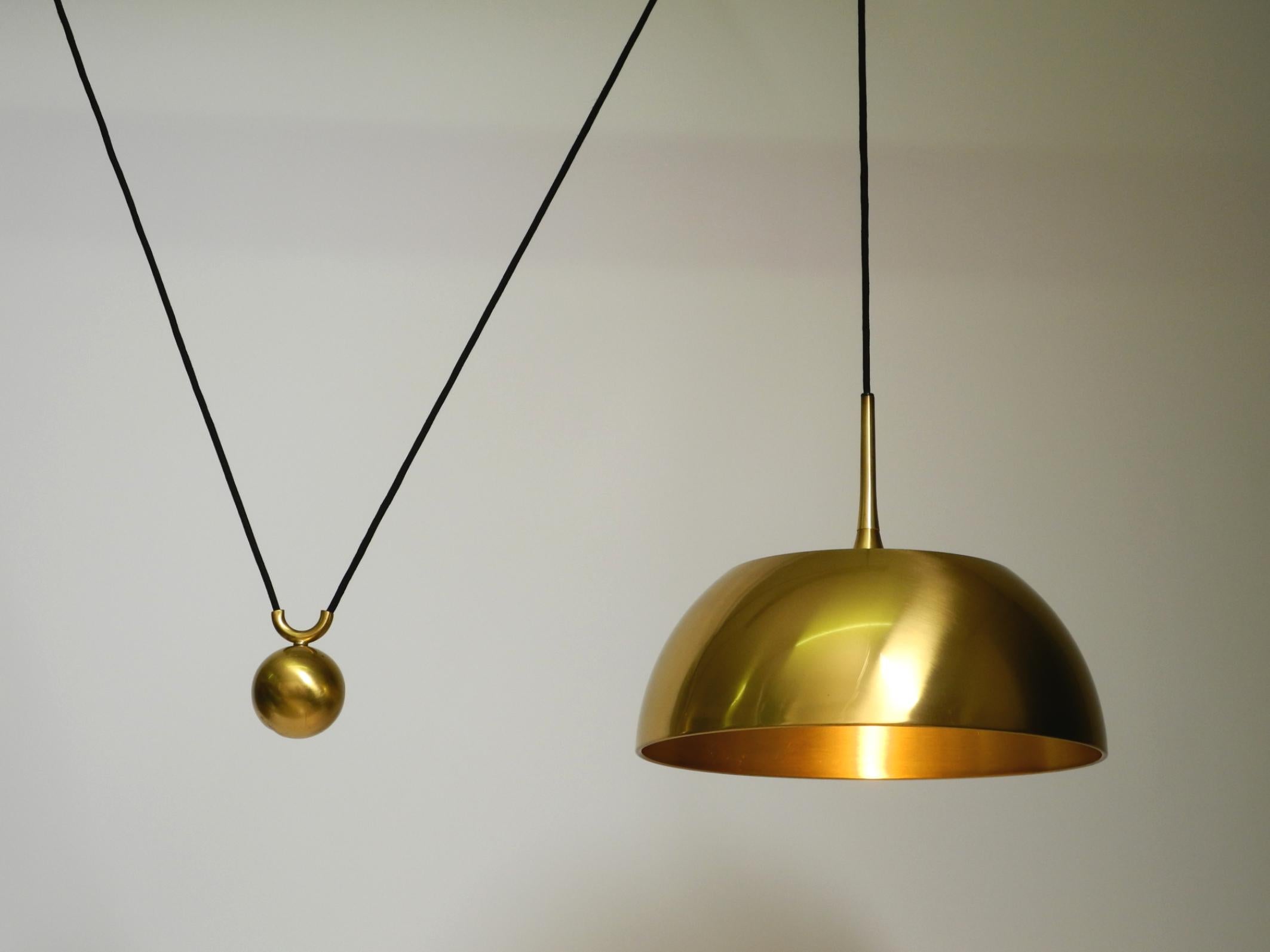 German Beautiful rare original 1970s Florian Schulz brass pendant light with pulley sys For Sale