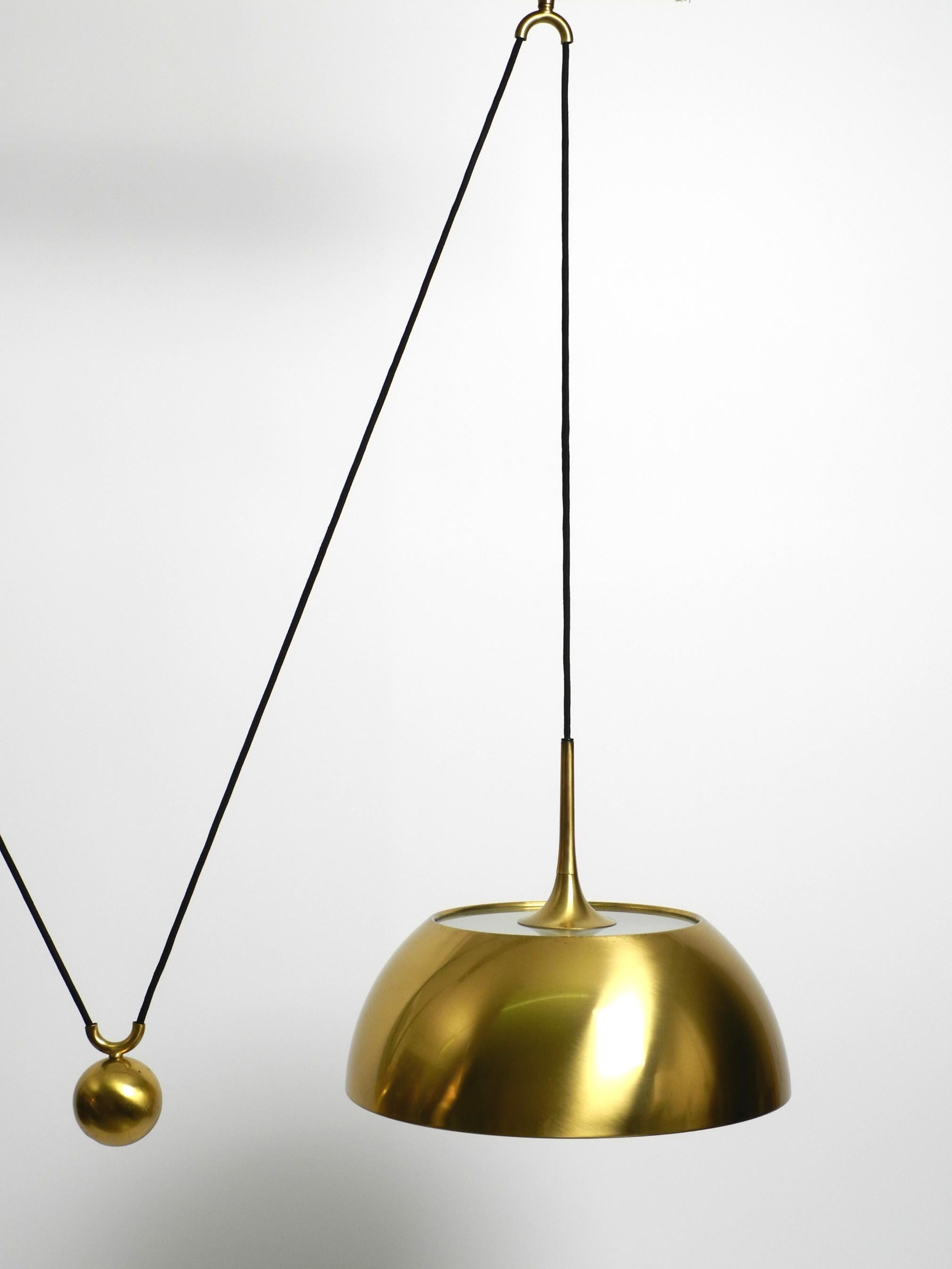 Beautiful rare original 1970s Florian Schulz brass pendant light with pulley sys In Good Condition For Sale In München, DE