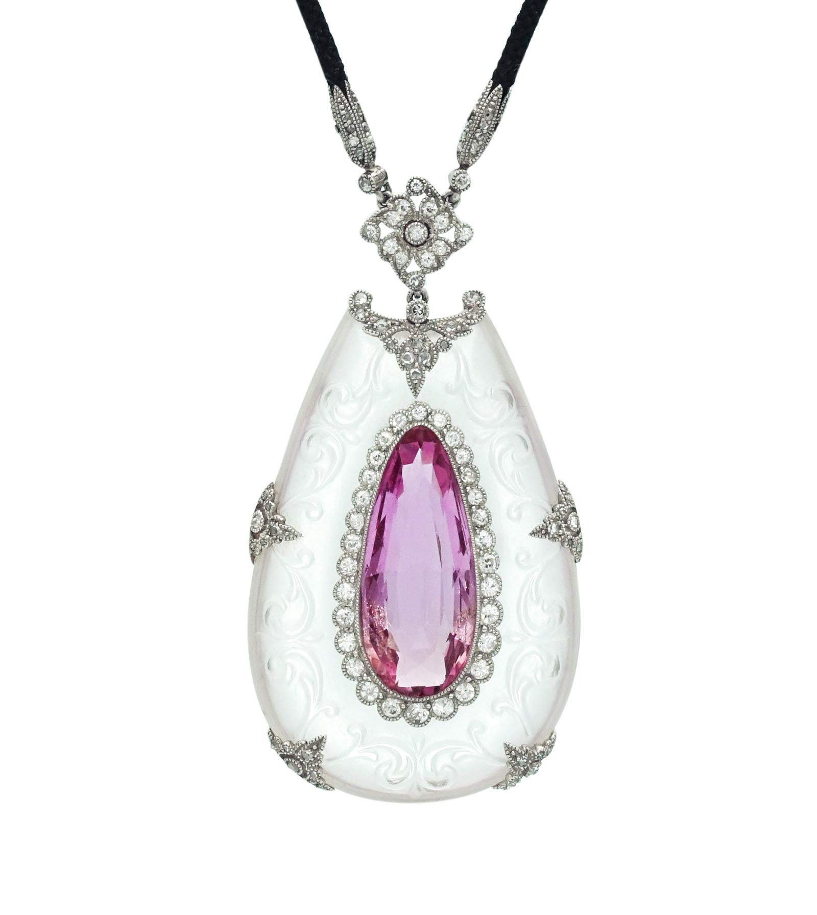 Beautiful and very rare pendant in rock crystal and platinum set with diamonds and a natural pink topaz, made in France in 1910 with maker's mark and French assay mark.