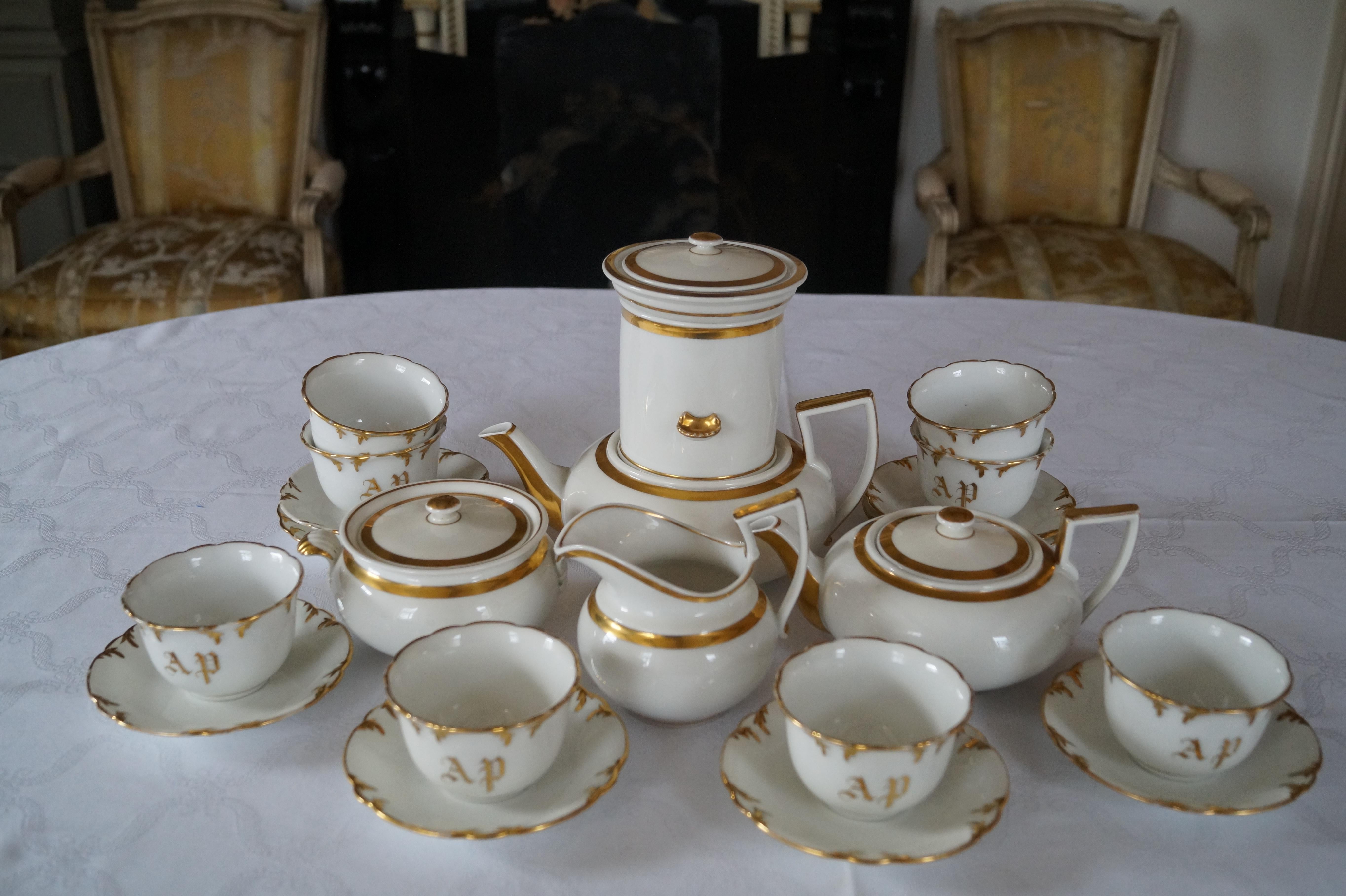 Beautiful, Rare shape model, Old Paris porcelain coffee tea set with coffee filter attachment and cup and saucers with monogram!

The coffee filter only fits the large coffee (tea) pot. Usually tea is not made with a coffee filter, so I assume it is