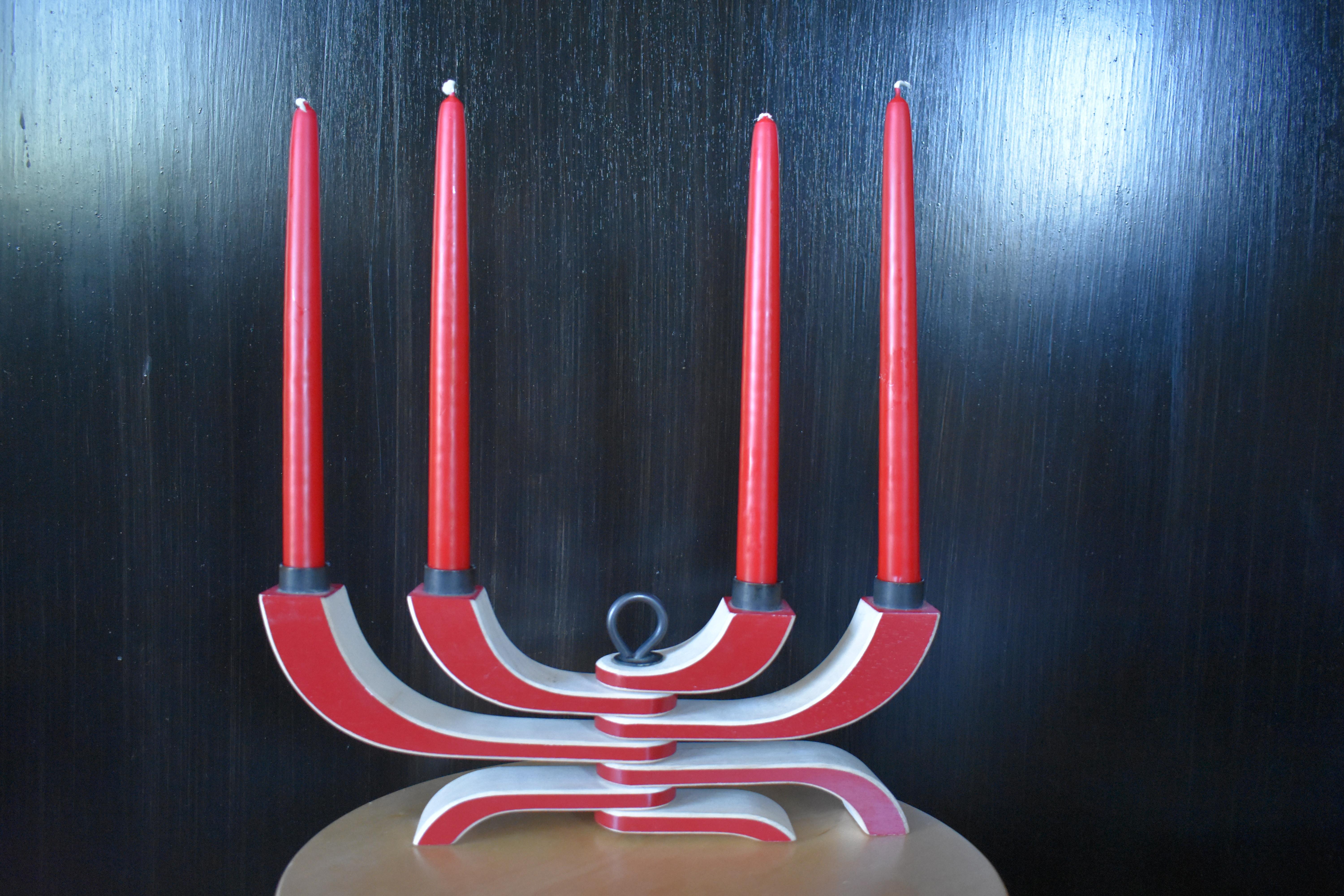 Beautiful four-arm Nordic light candle holder. Adjustable to change up the look for your table or fireplace mantle. Not just for Christmas.