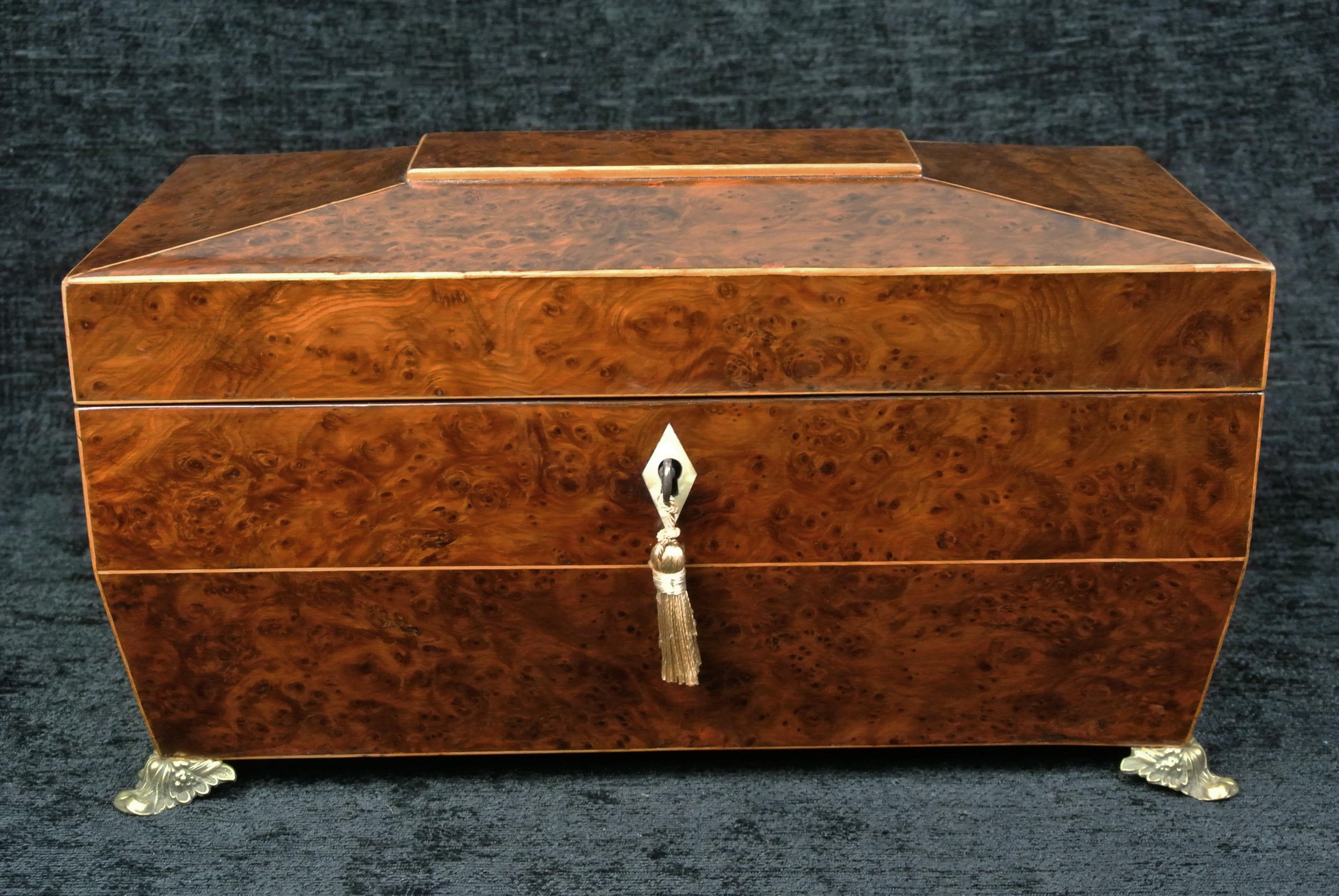 This is a very fine burr yew jewellery casket. Originally a Regency tea caddy, my restorer has worked on this for many months and has made this exquisite work of art. The inner figured brown oak compartment is made by hand and the whole interior is
