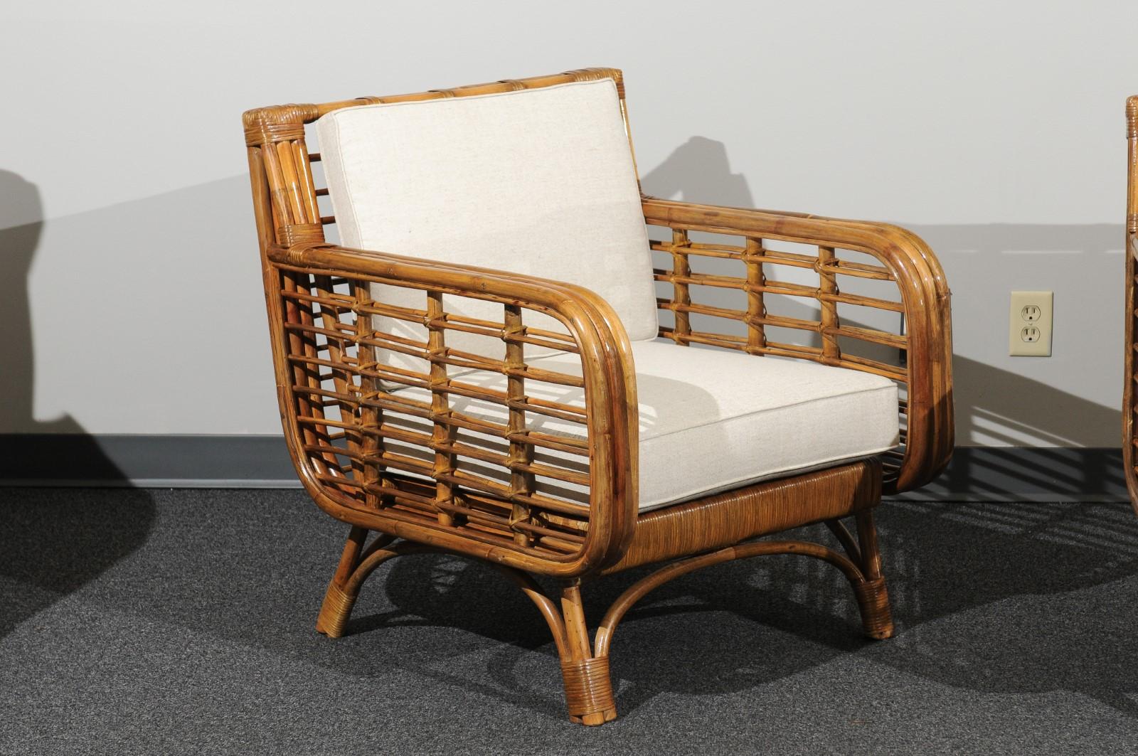 Mid-Century Modern Beautiful Restored Pair of Birdcage Style Rattan and Cane Loungers, circa 1955