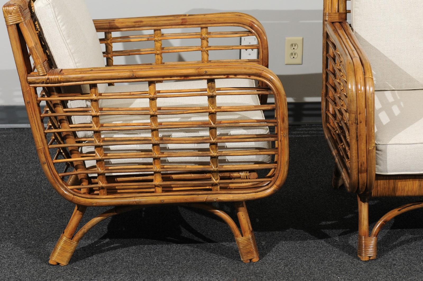 Mid-20th Century Beautiful Restored Pair of Birdcage Style Rattan and Cane Loungers, circa 1955