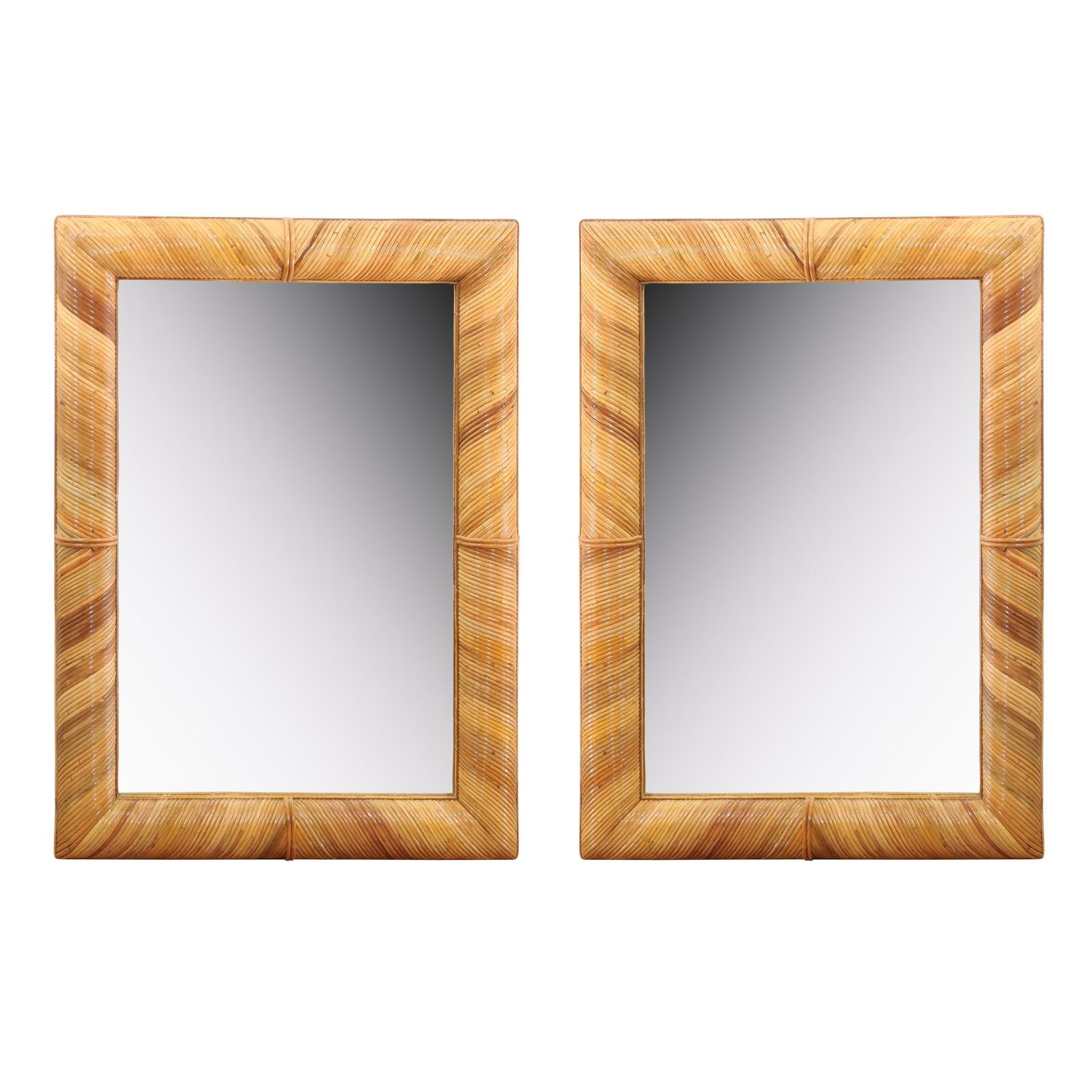 A fabulous vintage mirror, circa 1980. Stout hardwood frame painstakingly veneered in diagonally applied reed bamboo. Exceptional craftsmanship. Exquisite jewelry! Excellent restored condition. The piece has been professionally cleaned and