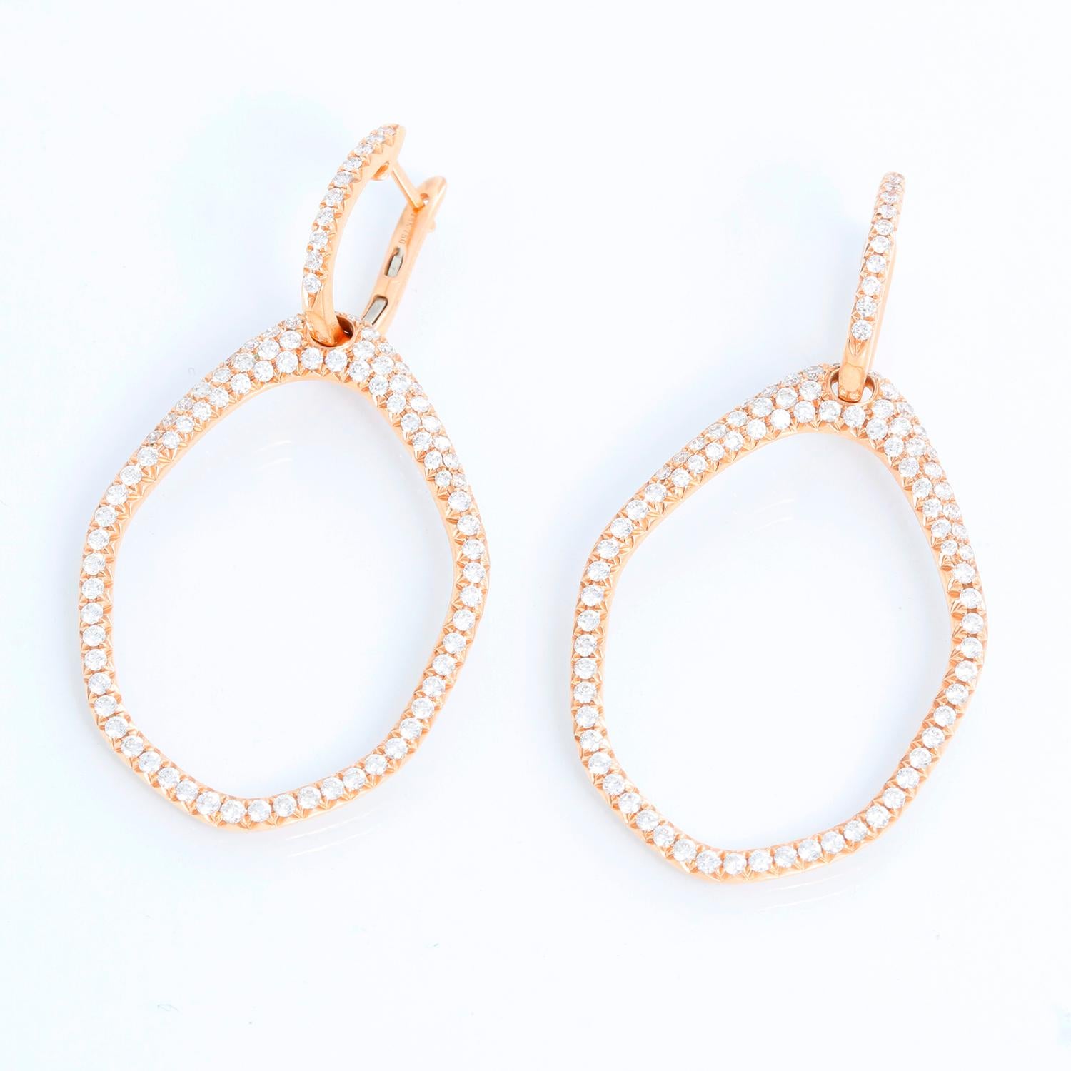 These beautiful 18k rose gold earrings feature 2.03 carats of very white SI1 clarity, H-color diamonds. These earrings are versatile and can be worn with or with out the dangling hoop. The earrings measure apx. 2-inches in length and 5/8-inch in