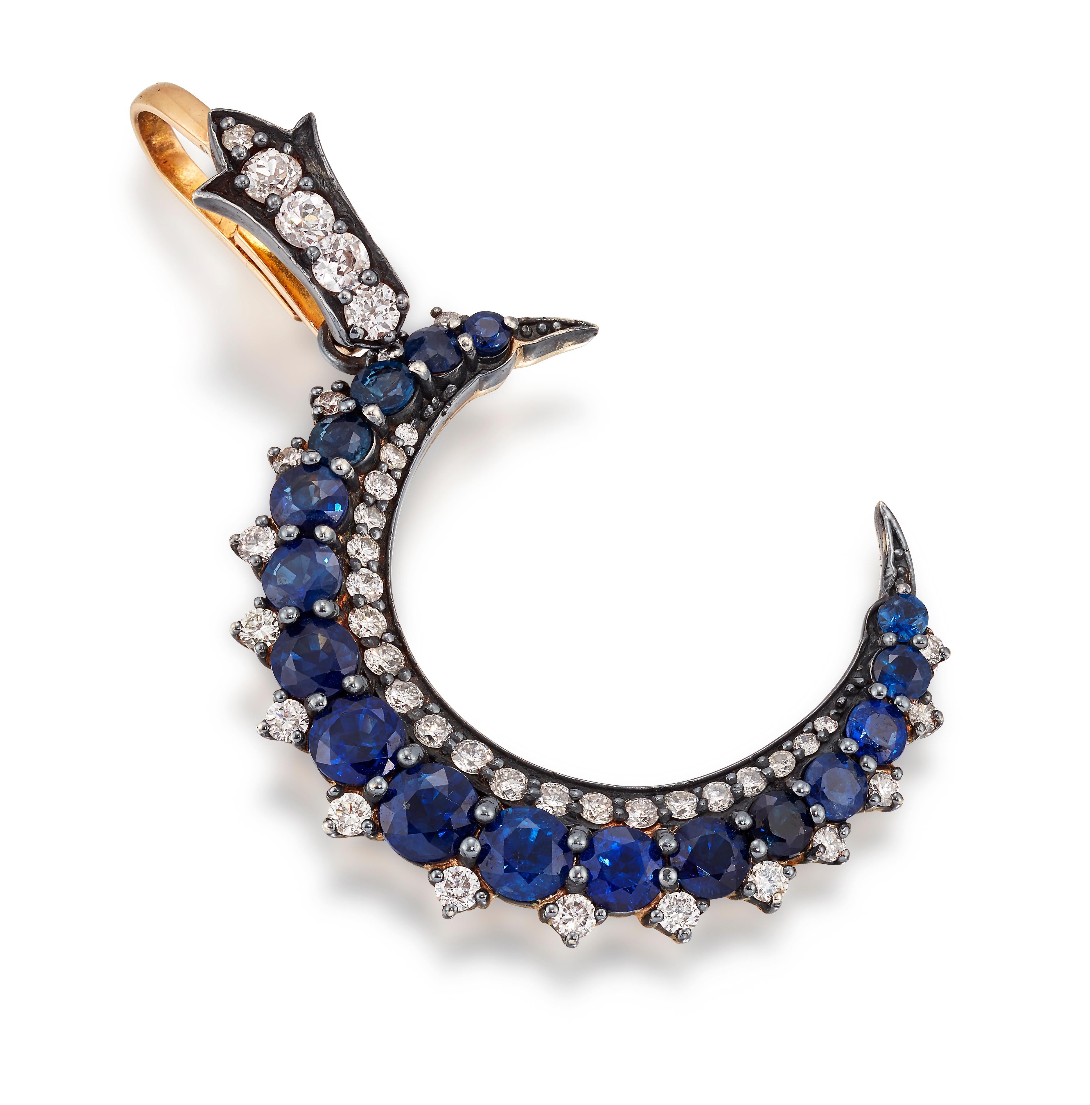 Handmade Sapphire and Diamond Crescent moon shape pendant.

Set with circular cut Sapphires and old cut Diamonds, mounted in 18ct yellow gold and Silver.  