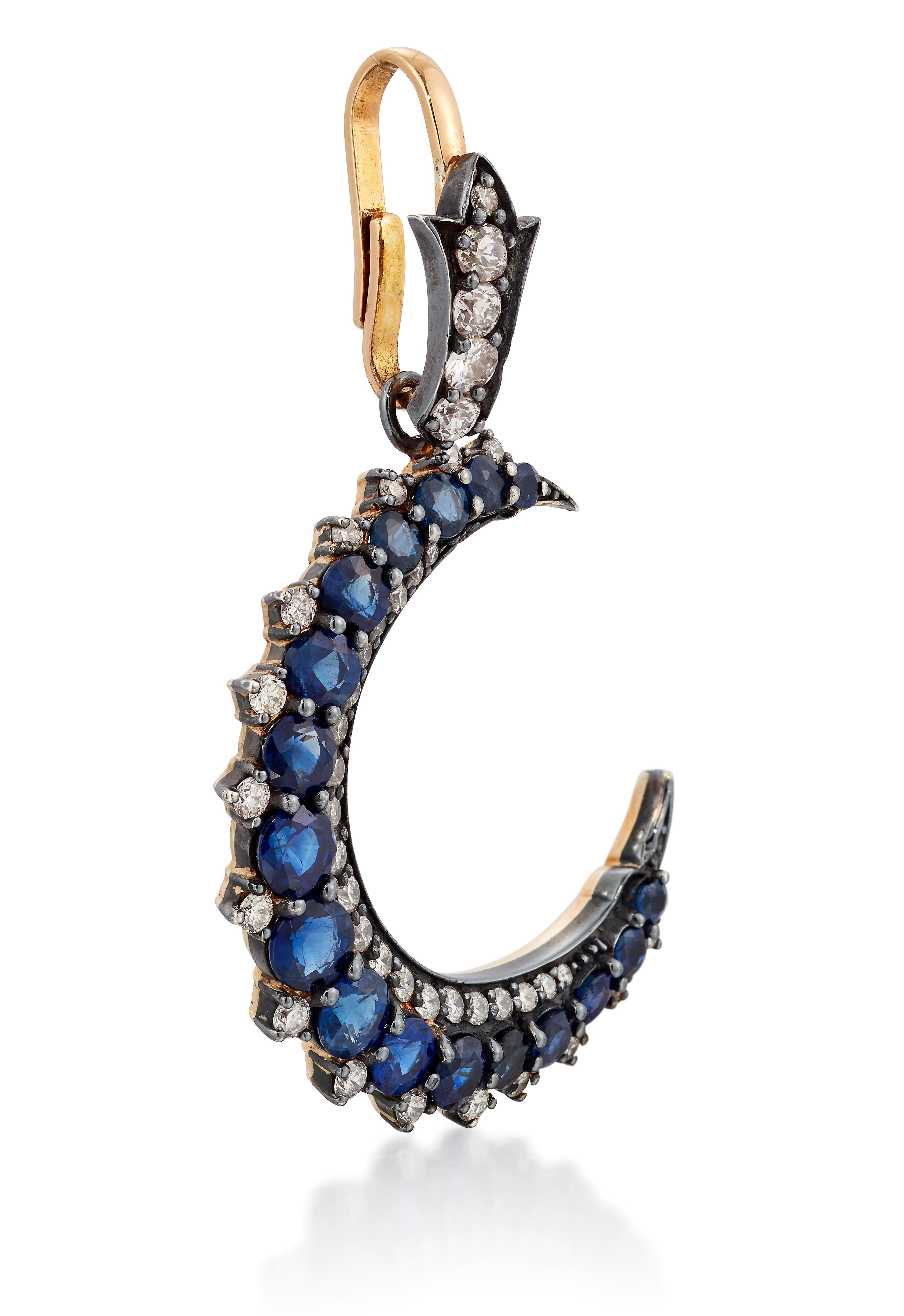 Contemporary Beautiful Sapphire and Diamond crescent moon pendant. For Sale