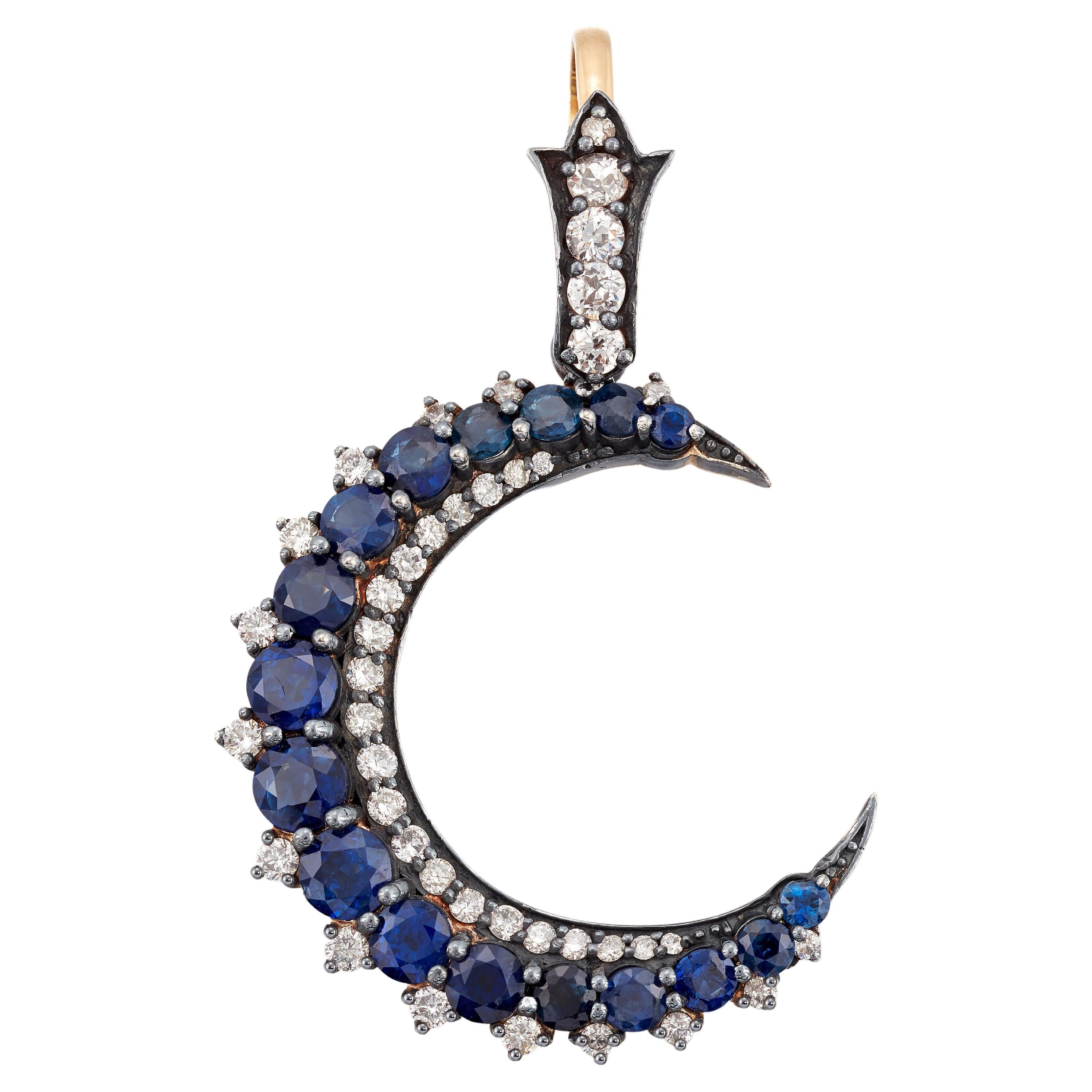 Beautiful Sapphire and Diamond crescent moon pendant. For Sale