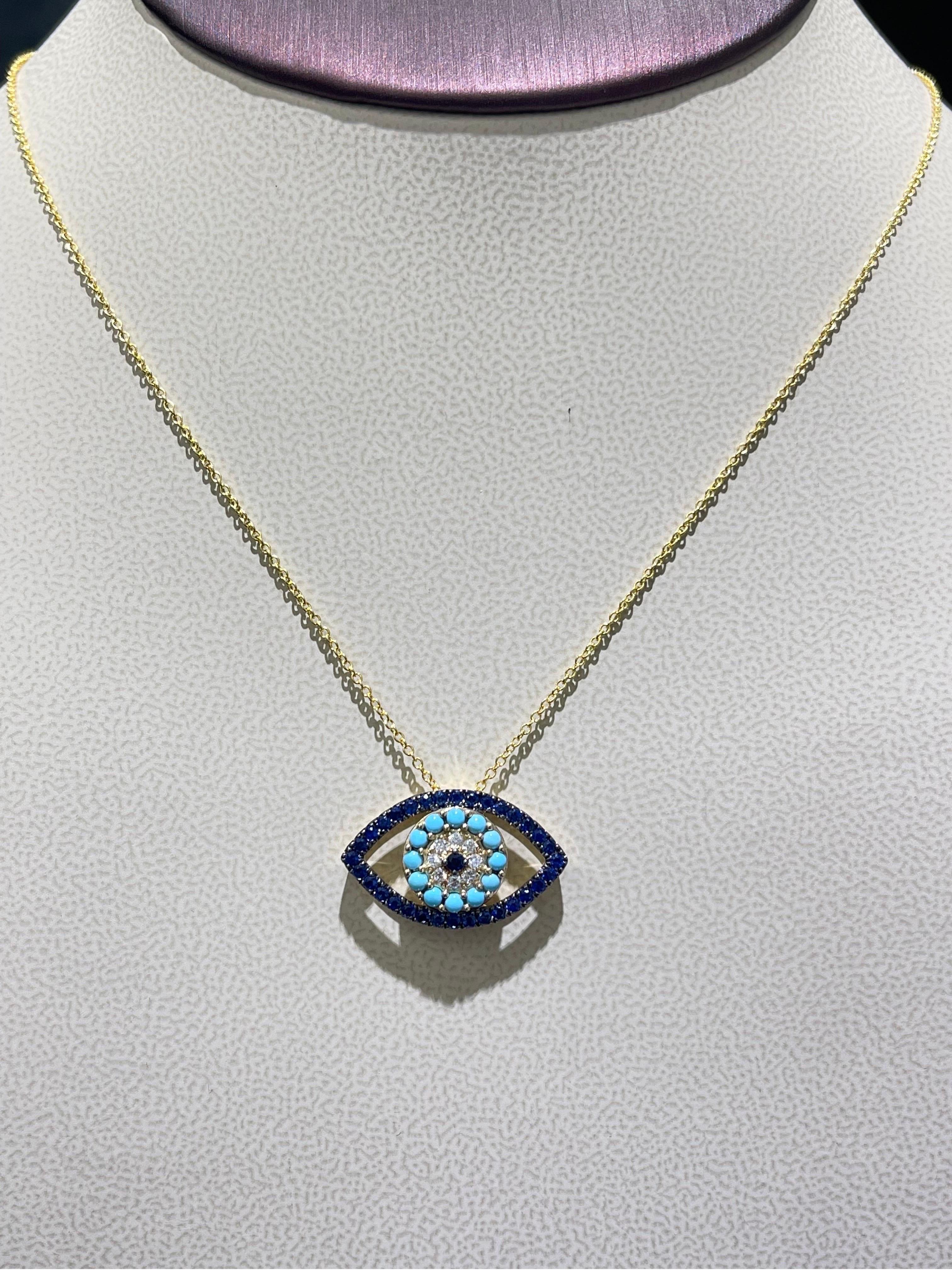 Beautiful Sapphire, Turquoise & Diamond Devil Eye Necklace In 14k.

- 0.11 carats in diamonds,

- 1.1 carats in blue sapphires & turquoise,

- length is adjustable 18” or 16”,

- width of the Eye is 1”,

Retail $3,874