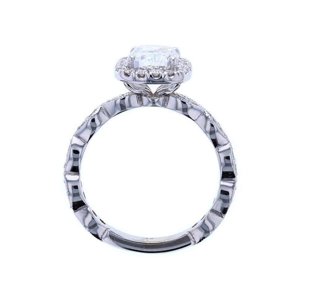 We love the timeless look of a scalloped diamond shank and adore this cushion cut diamond engagement ring with marquise shaped diamond scallops and a beautiful diamond halo surrounding the center diamond. 

This style of engagement ring can be made