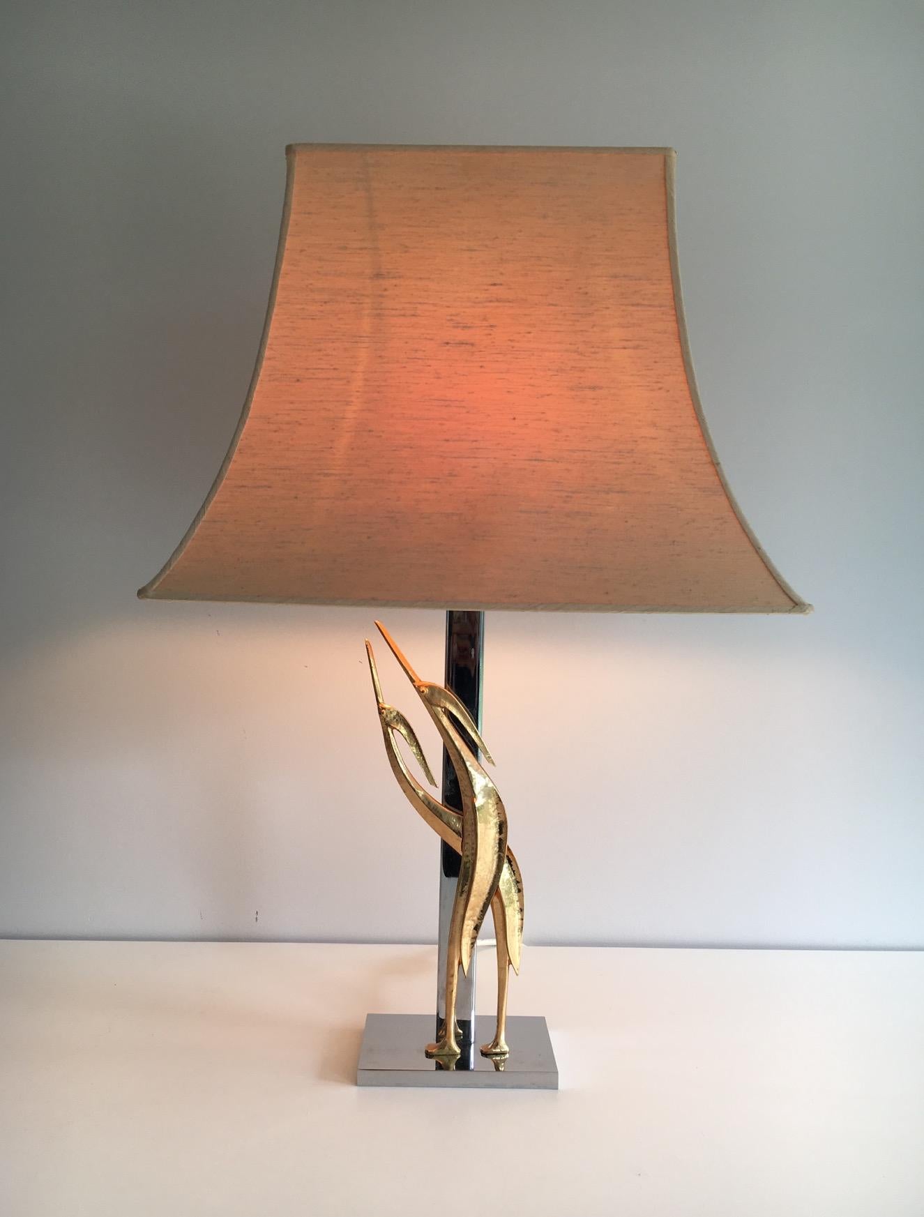 This beautiful lamp is made of chrome with bronze design sculptural birds. This is a French work, circa 1970.